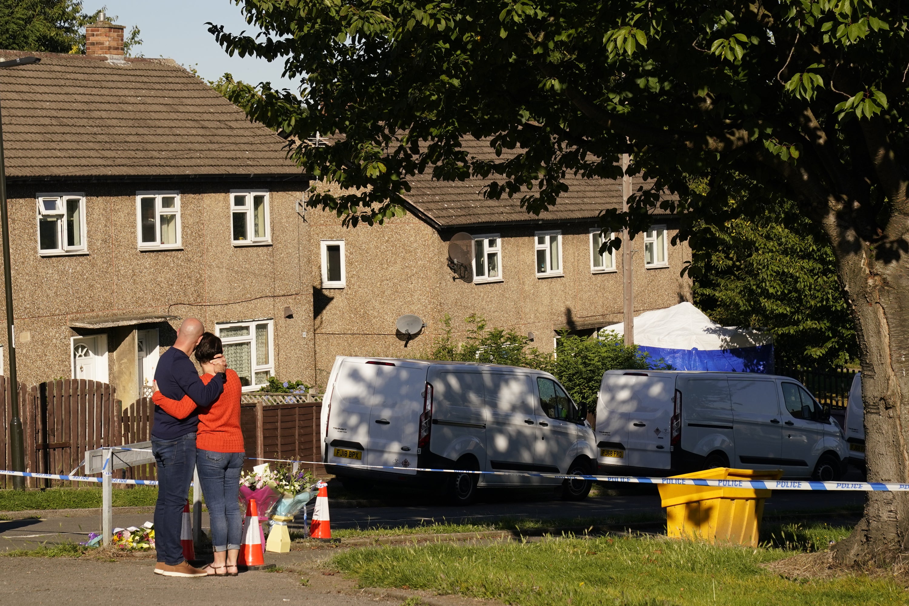 The father to some of the victims leaves flowers at the scene in Chandos Crescent, Killamarsh (Danny Lawson/PA)