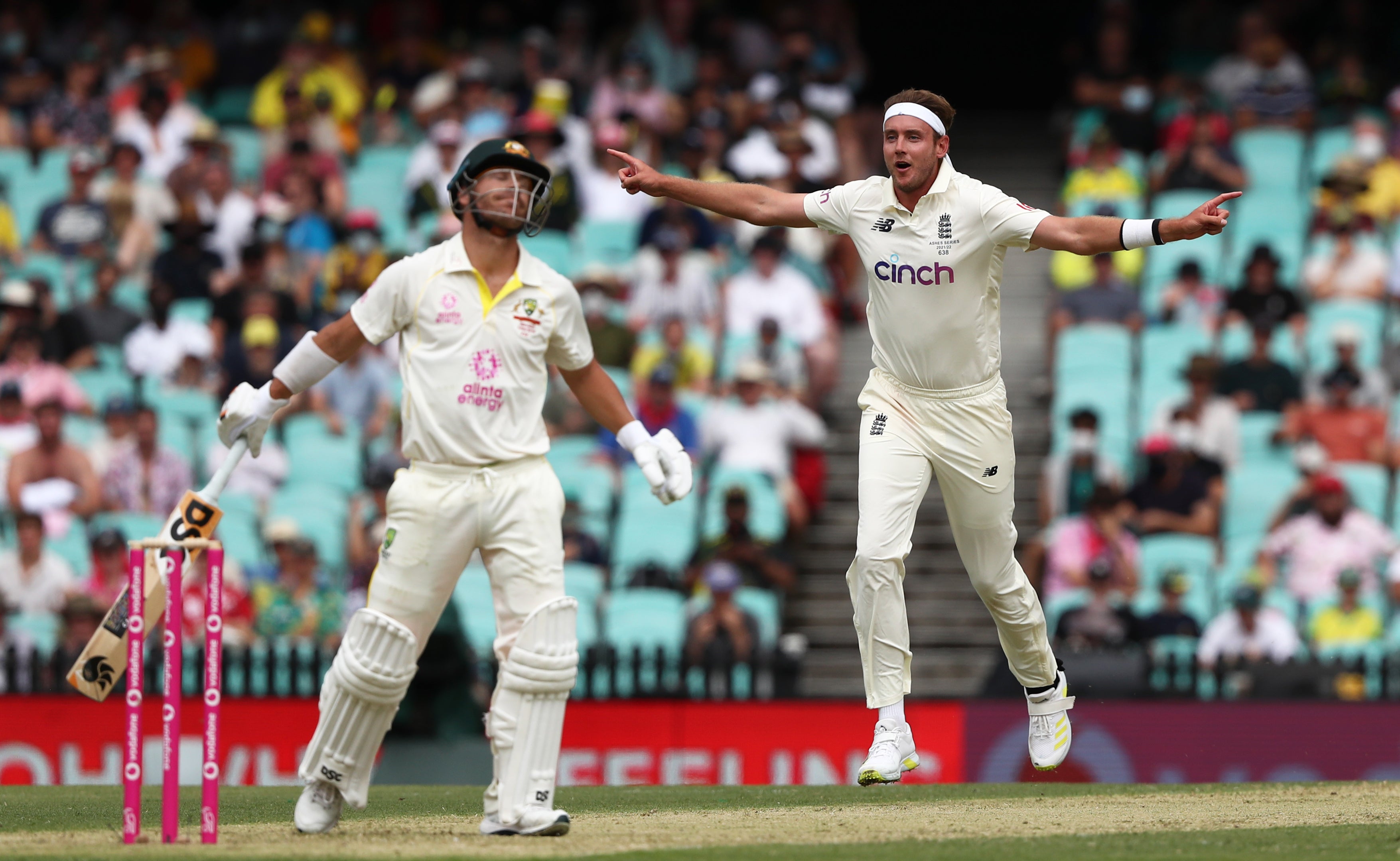 England’s Stuart Broad celebrates the wicket of Australia’s David Warner (Jason O’Brien/PA)