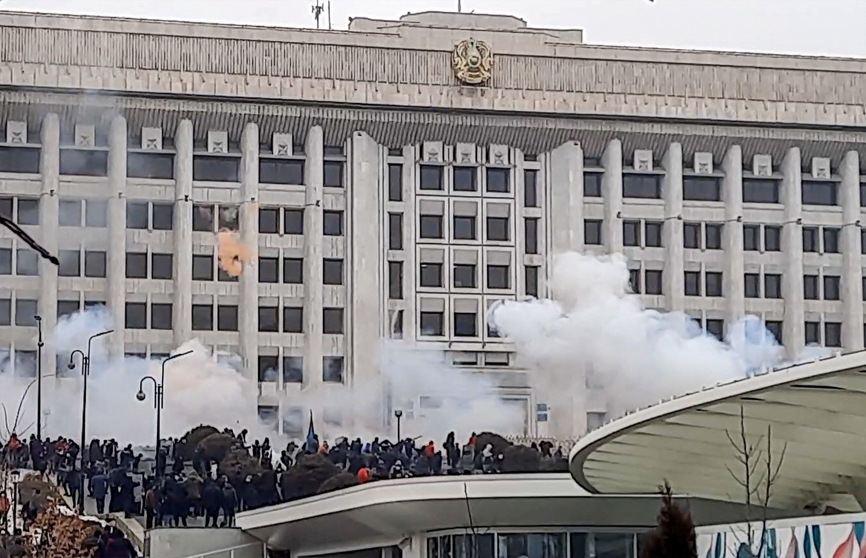 Protesters near the Almaty mayor’s office during a rally over a hike in energy prices