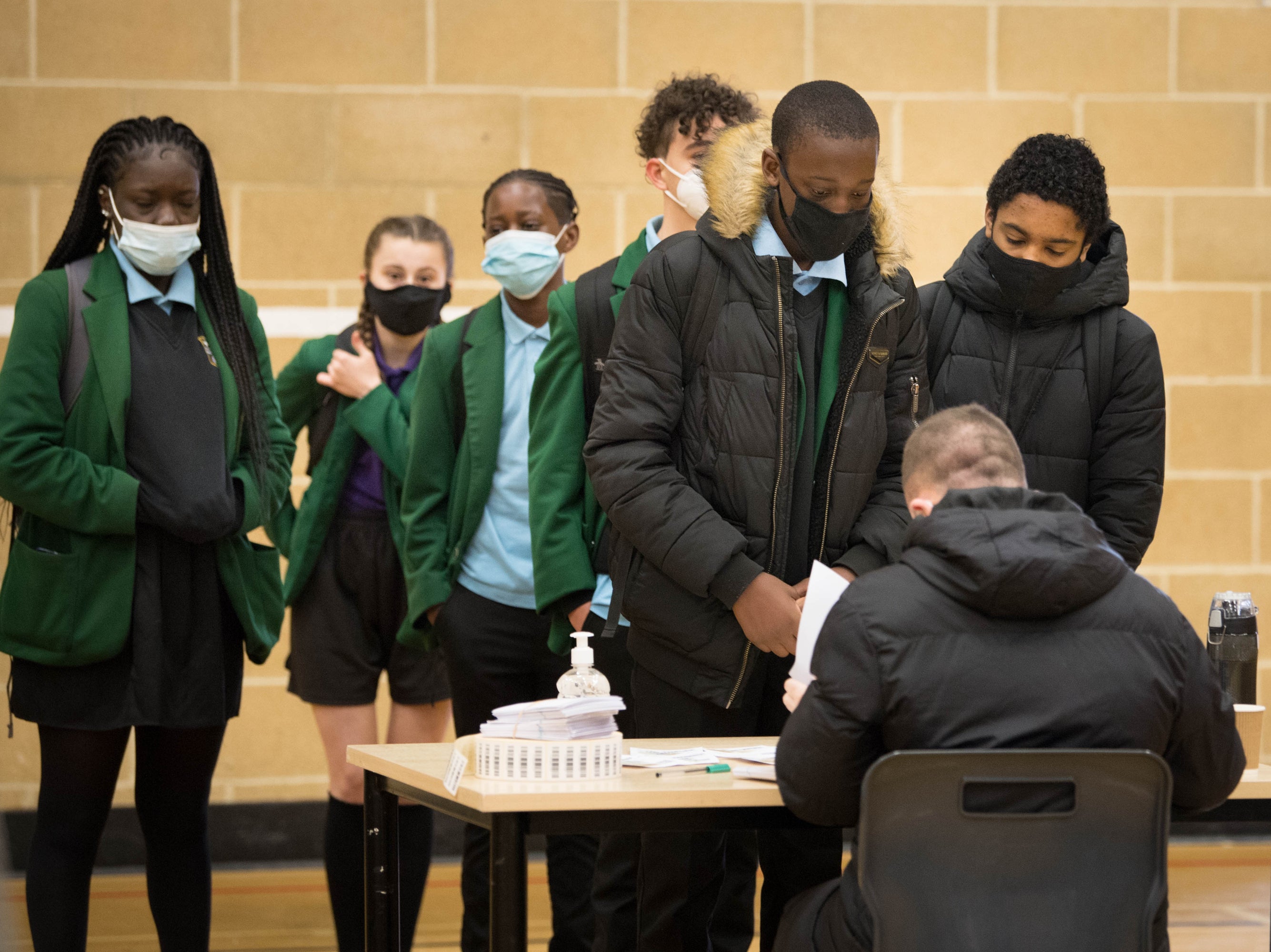 Pupils at Sydney Russell School in Dagenham, east London, queue up to be tested