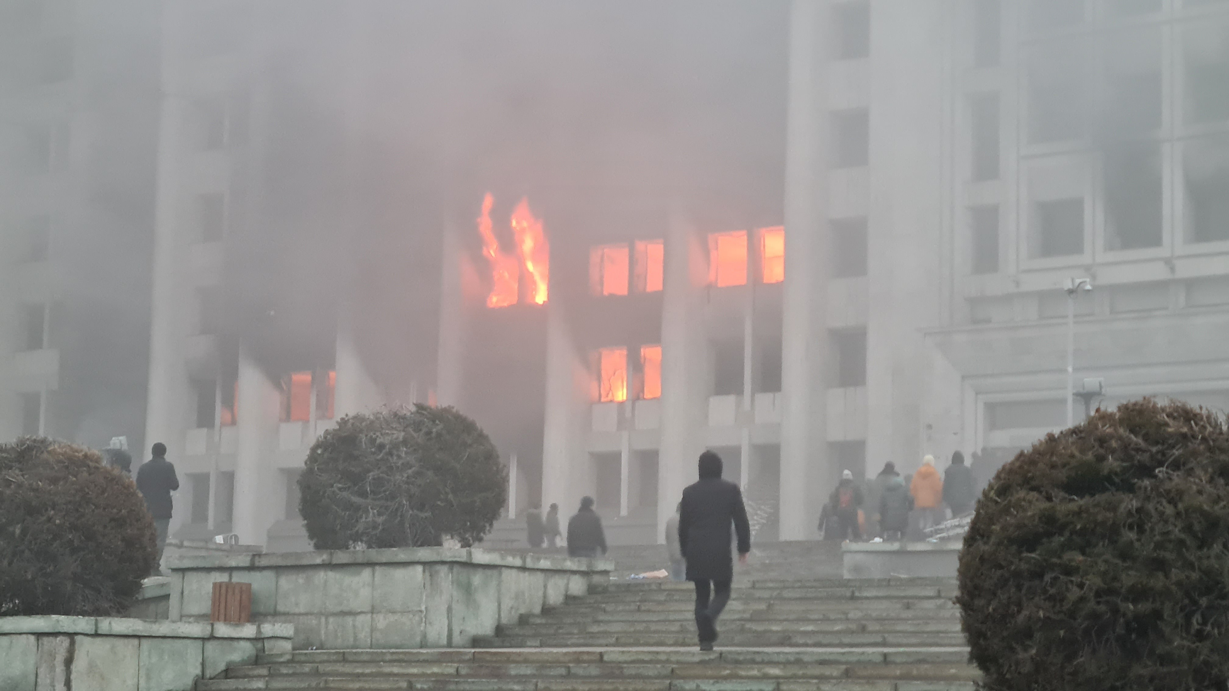 Protesters are seen as they enter the governor’s office in Almaty, Kazakhstan