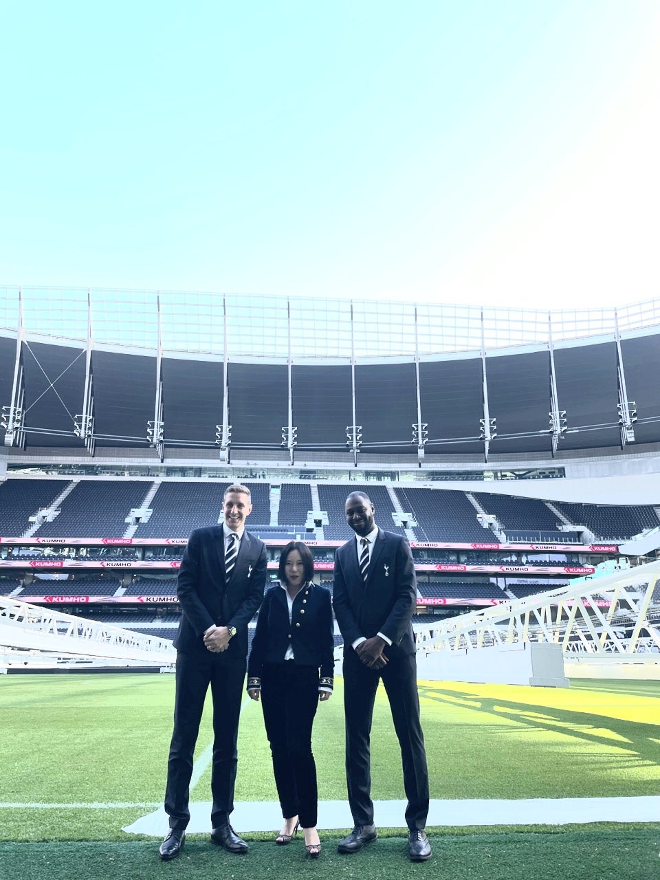 Kim at Tottenham Hotspur Stadium, alongside former players Michael Dawson (left) and Ledley King