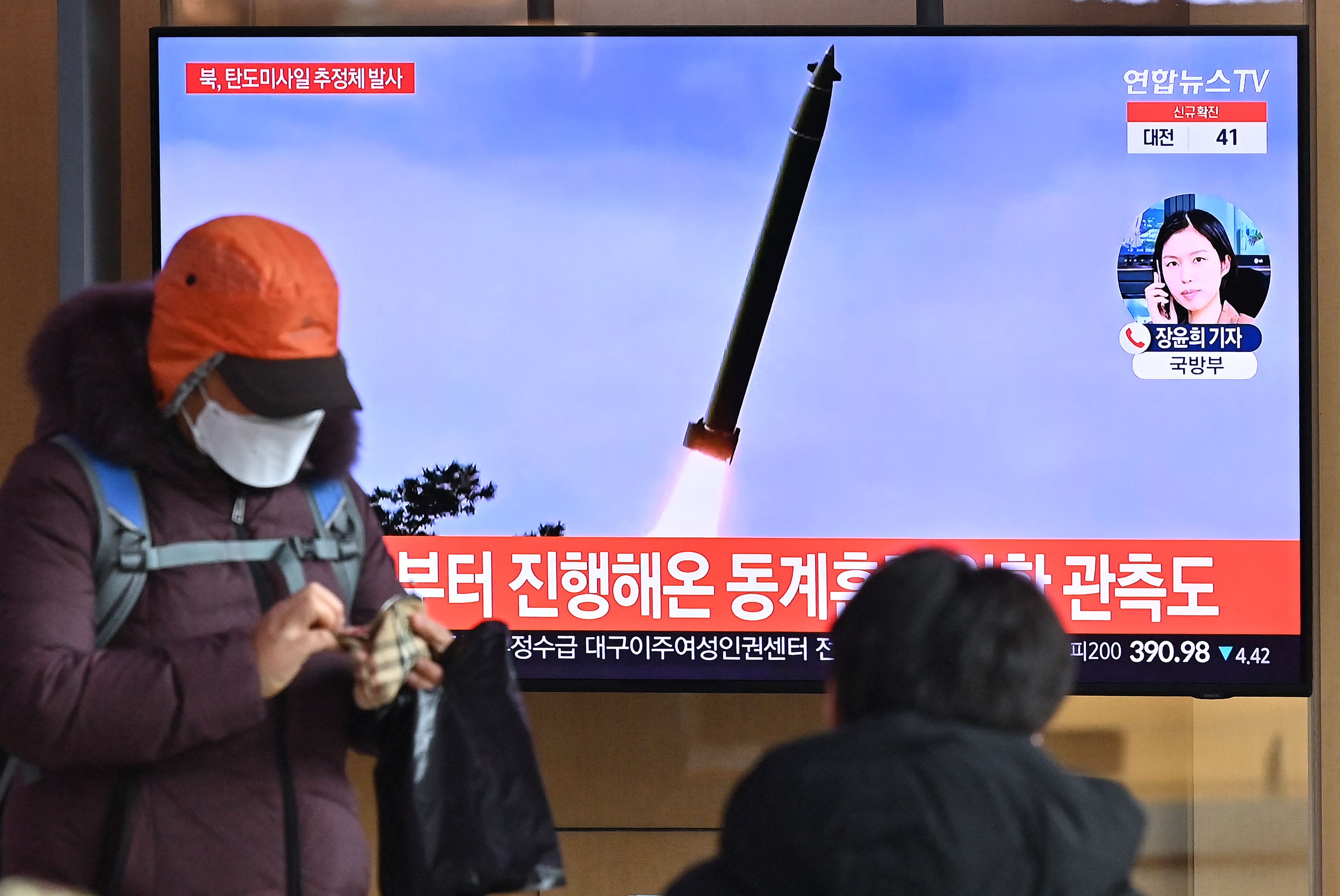 A TV news broadcast showing file footage of a North Korean missile test, at a railway station in Seoul, South Korea, on 5 January 2022