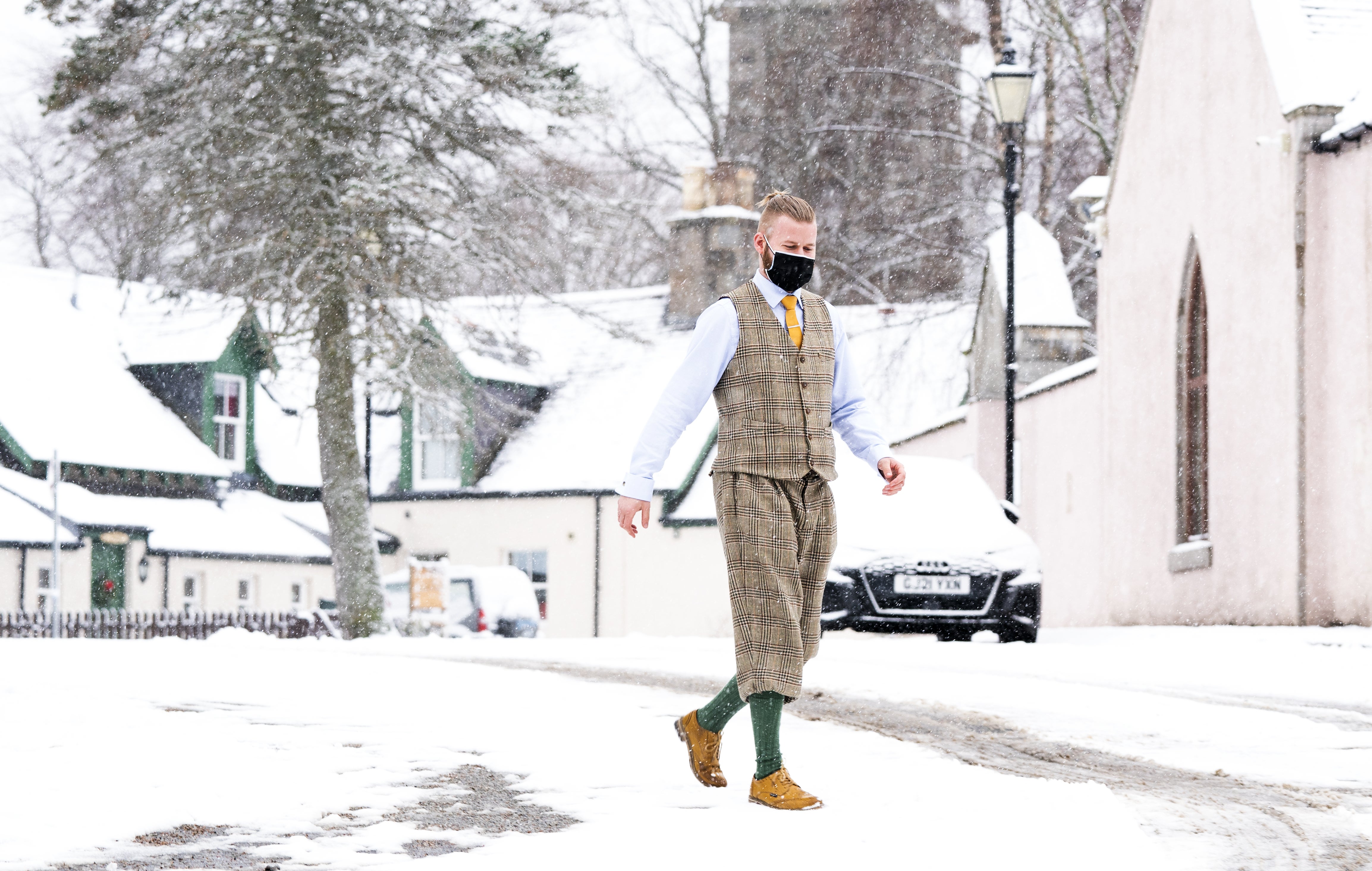 A man walks through the snow in Braemar, Aberdeenshire (Jane Barlow/PA)