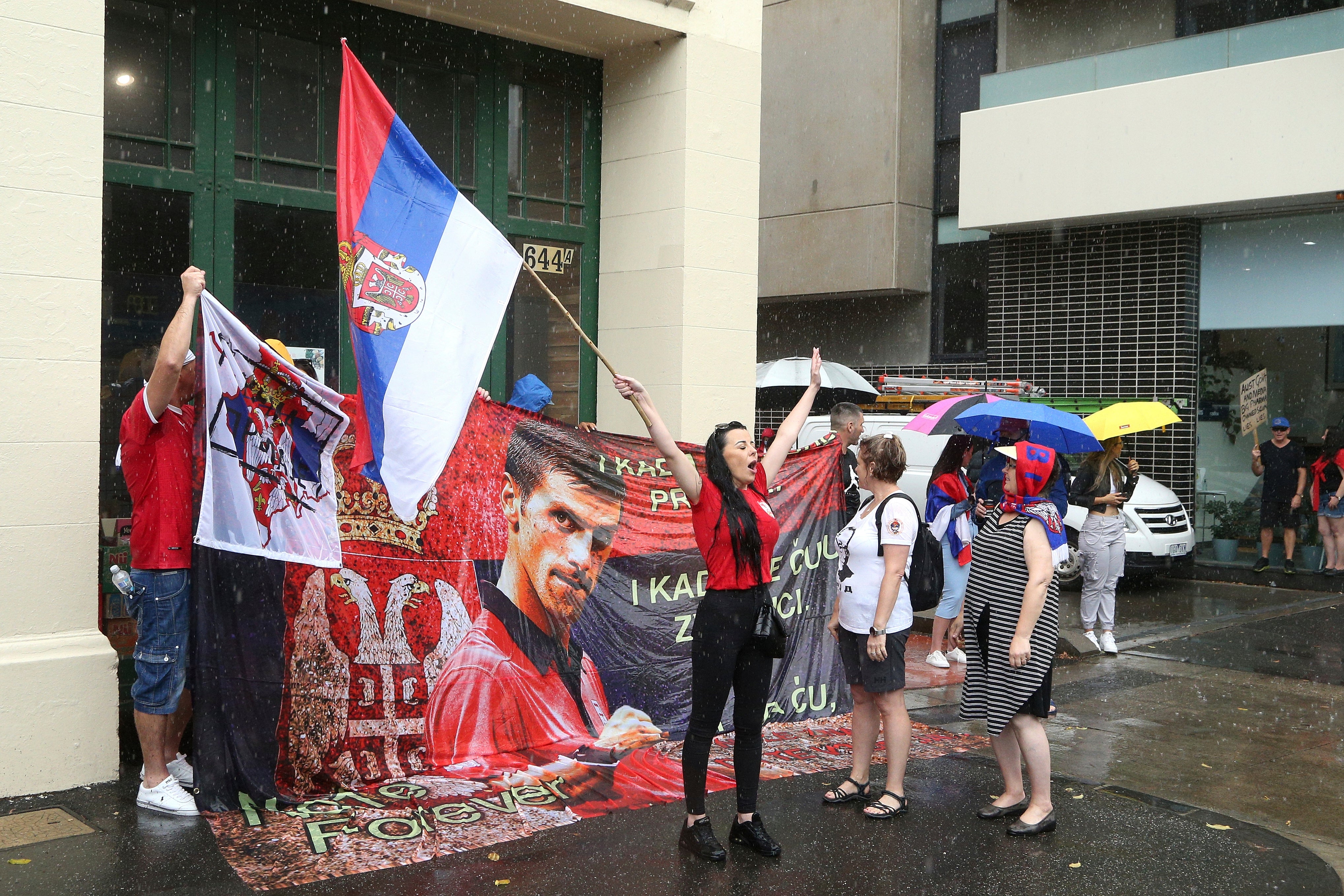 Protestors gather outside the Park Hotel in Melbourne