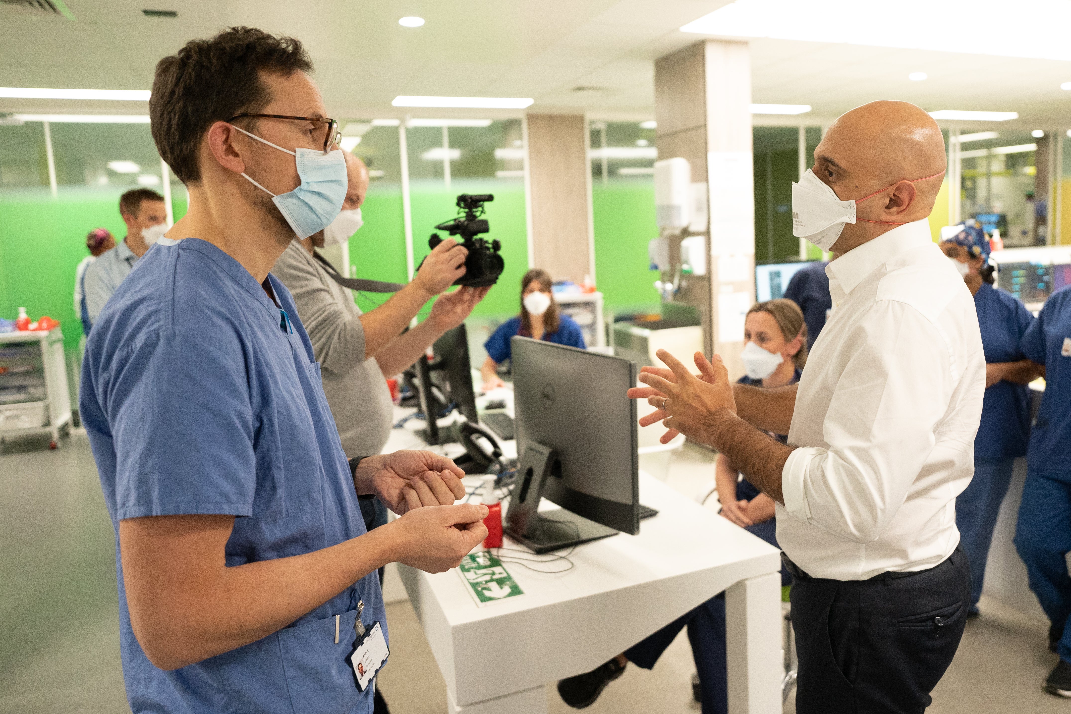 Health Secretary Sajid Javid talks to Steve James during a visit to King’s College London (Stefan Rousseau/PA)