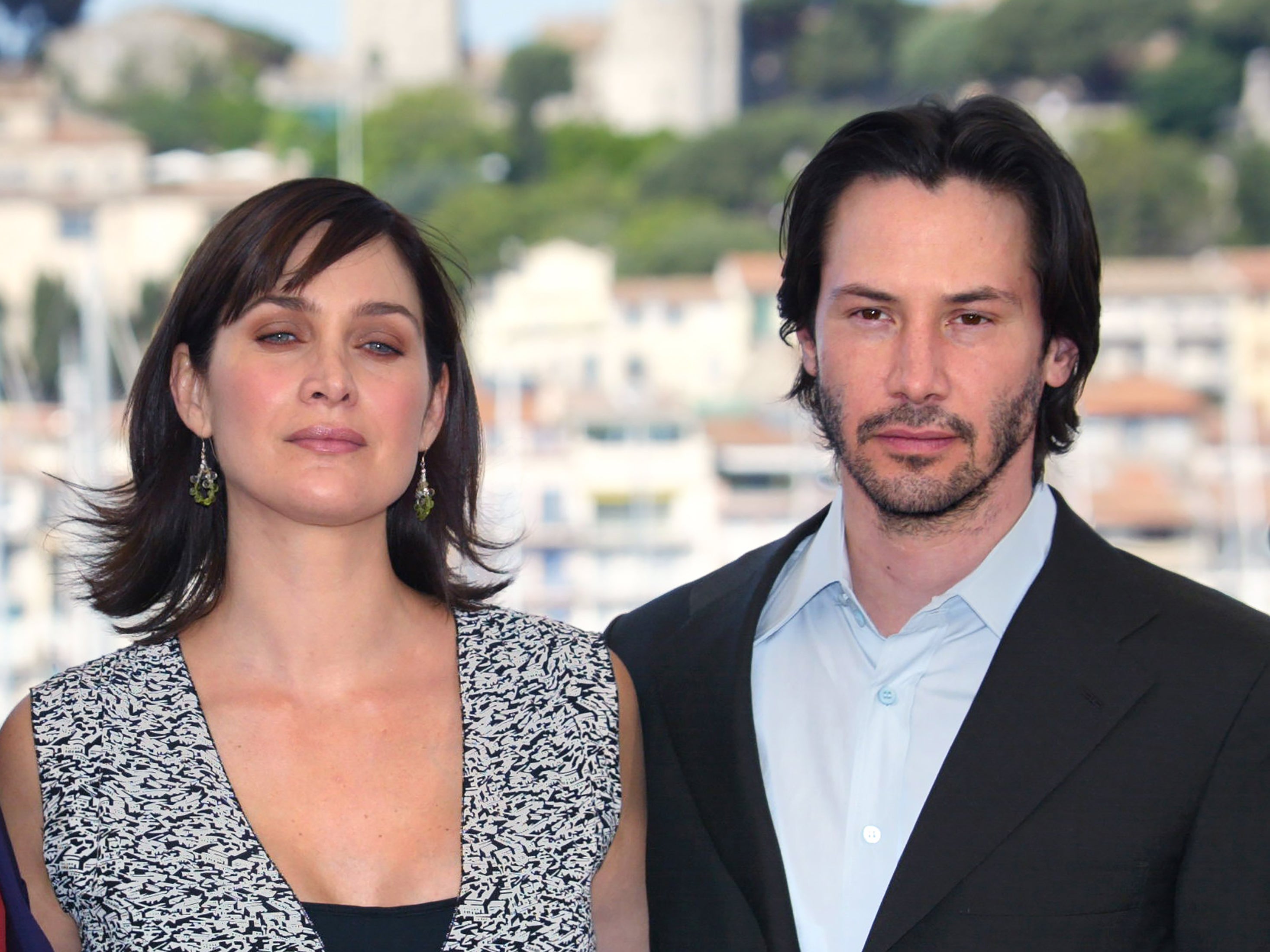 Keanu Reeves and Carrie-Anne Moss at a photocall for ‘The Matrix Reloaded’ at the Cannes Film Festival on 15 May 2003