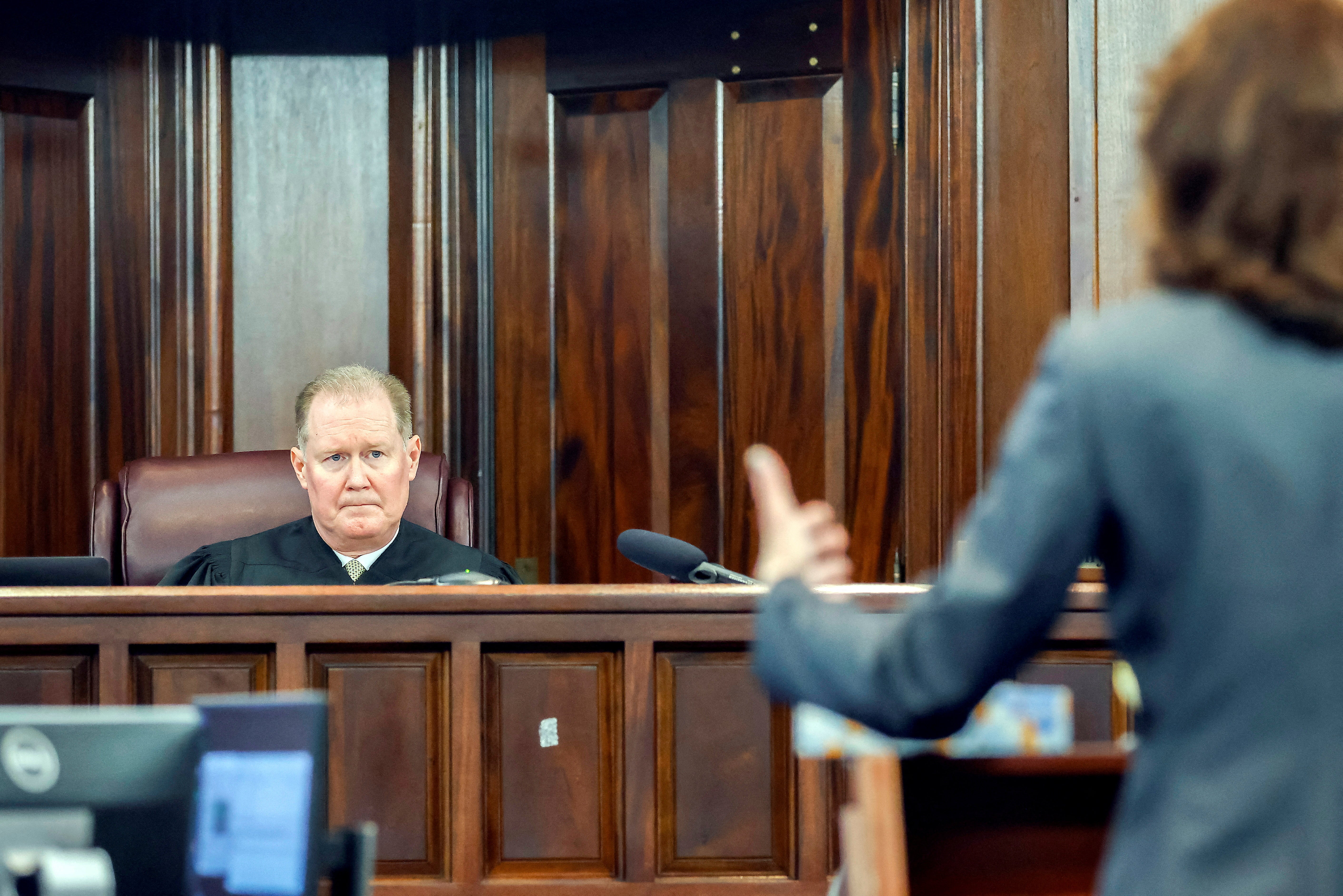 Superior Court Judge Timothy Walmsley, left, listens to prosecutor Linda Dunikoski's opening statement during the sentencing of Greg McMichael and his son, Travis McMichael, and a neighbor, William "Roddie" Bryan.