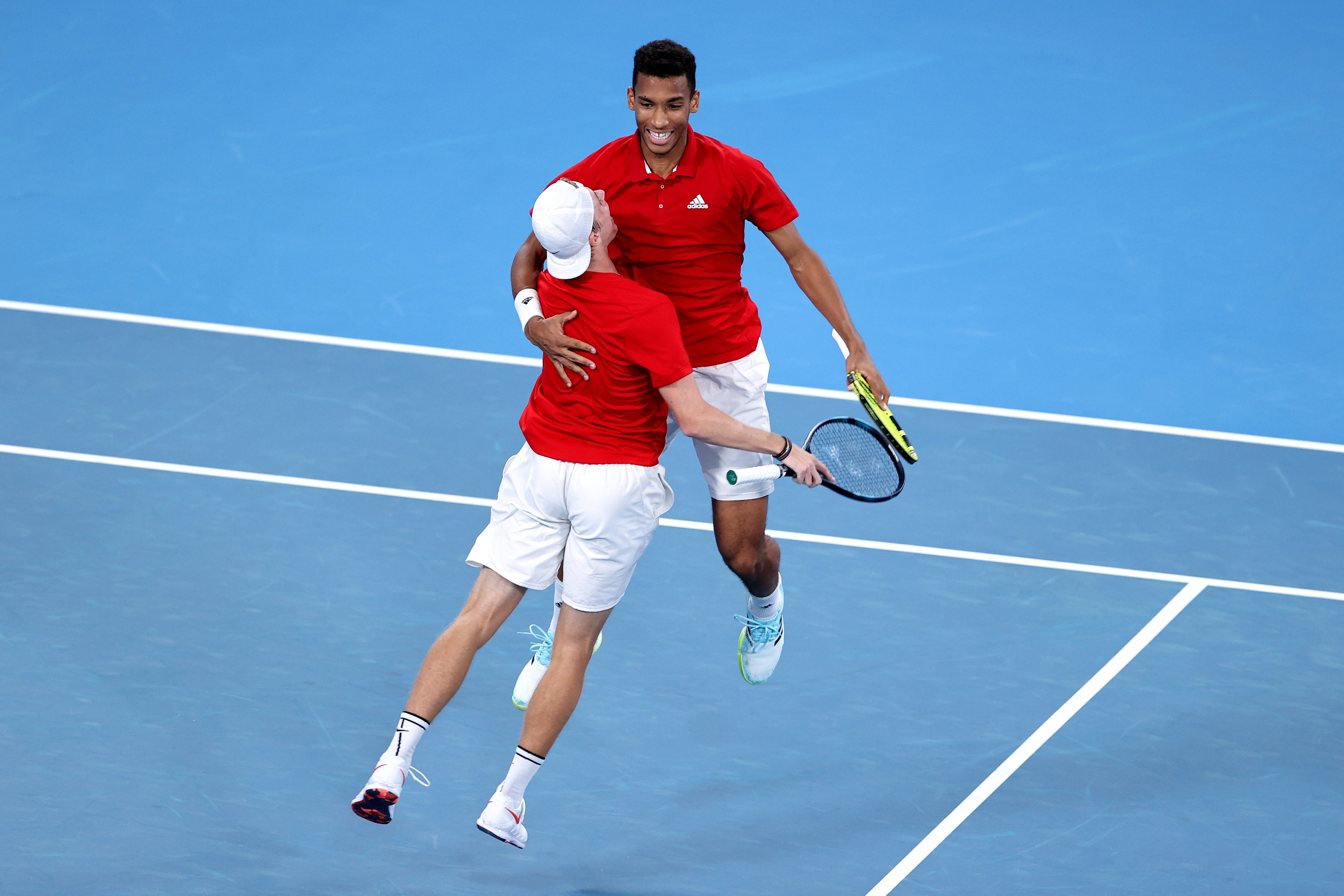 Denis Shapovalov and Felix Auger-Aliassime celebrate their win