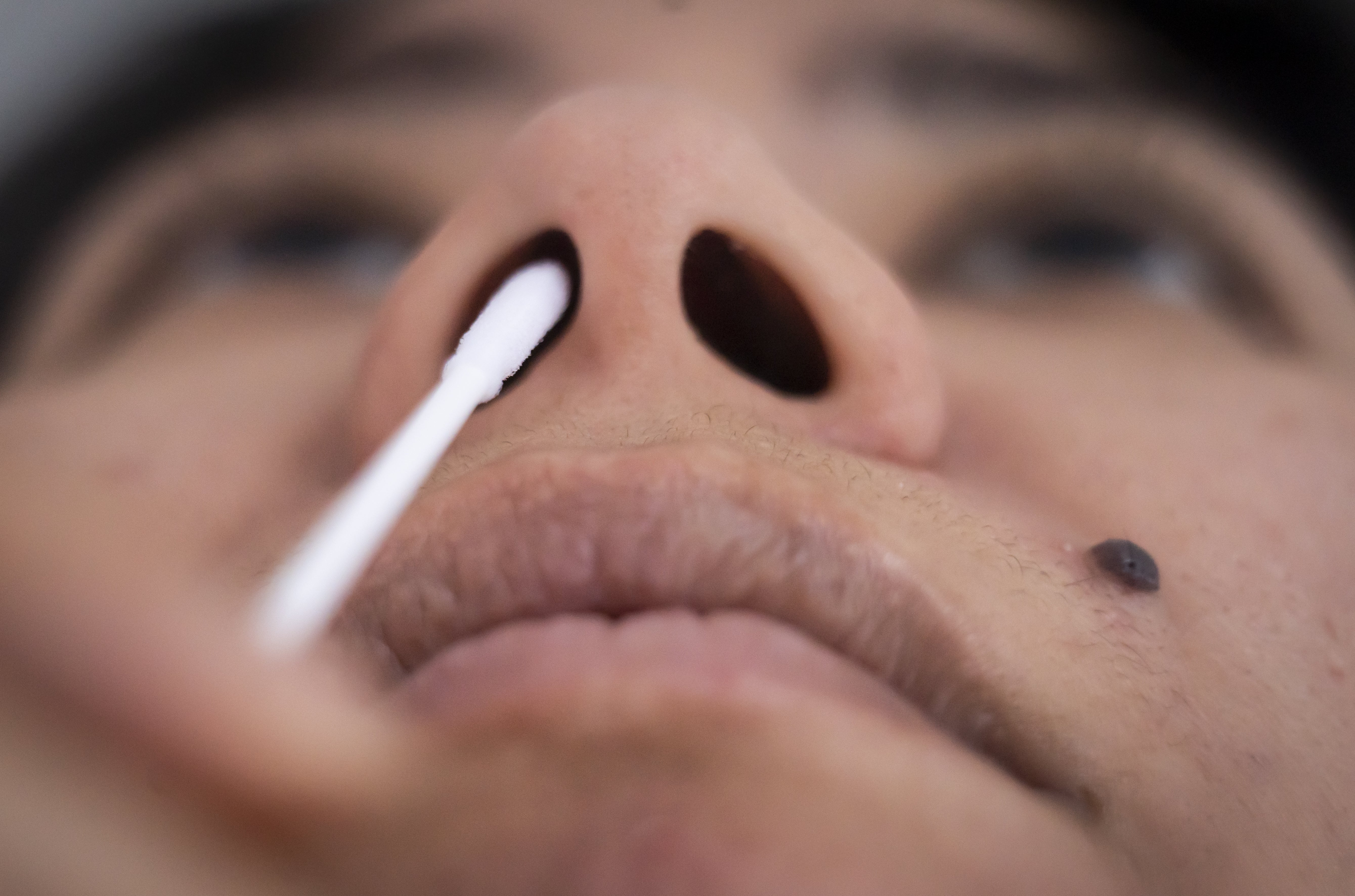 A person taking a Covid 19 lateral flow test. (Danny Lawson/PA)