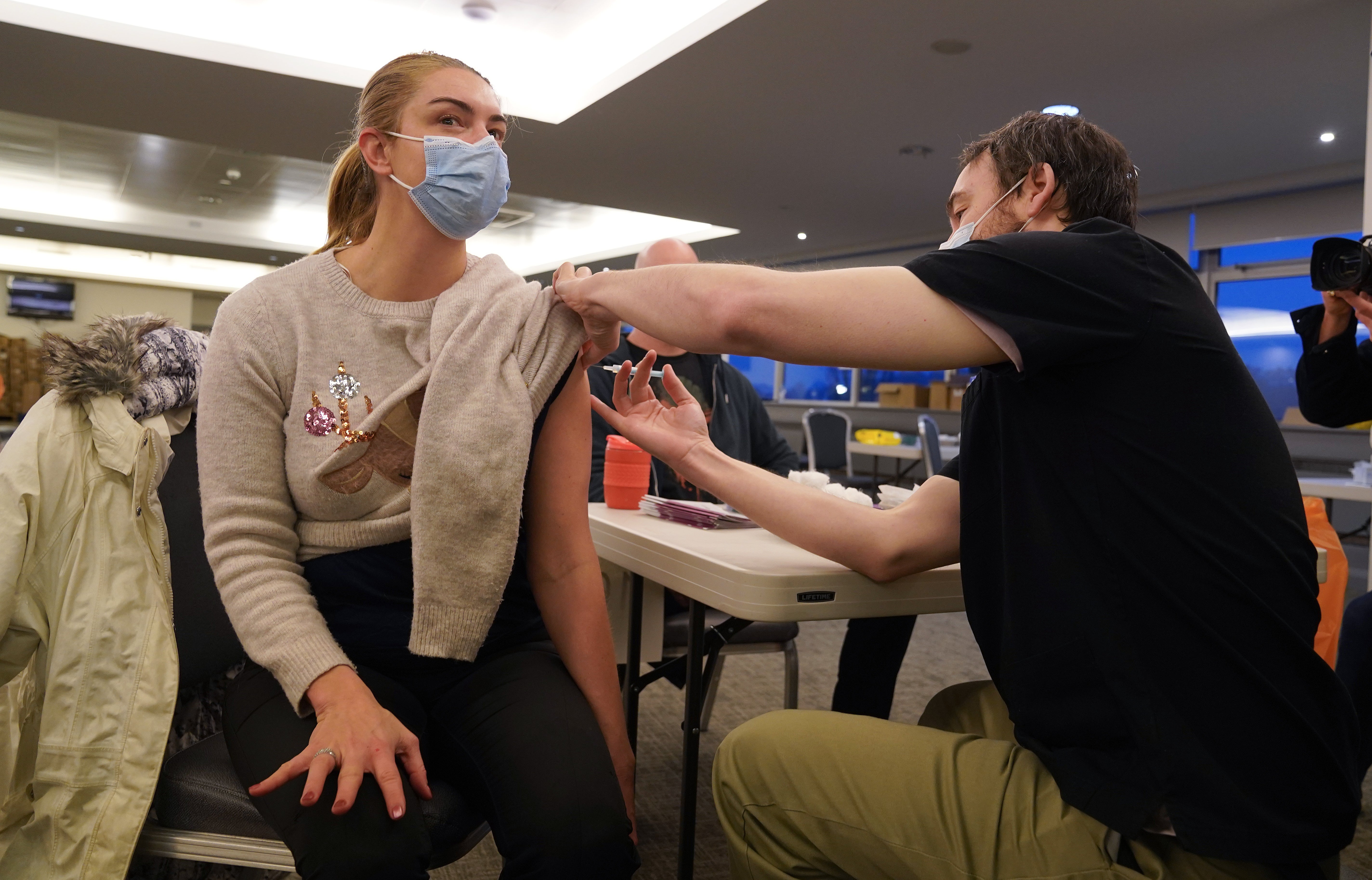 Reece Maclean is given a vaccination at a Covid-19 booster centre at Hampden Park in Glasgow (Andrew Milligan/PA)