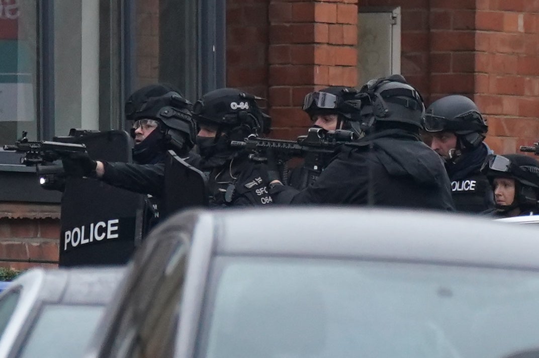 The 41-year-old is “believed to be armed”, police said