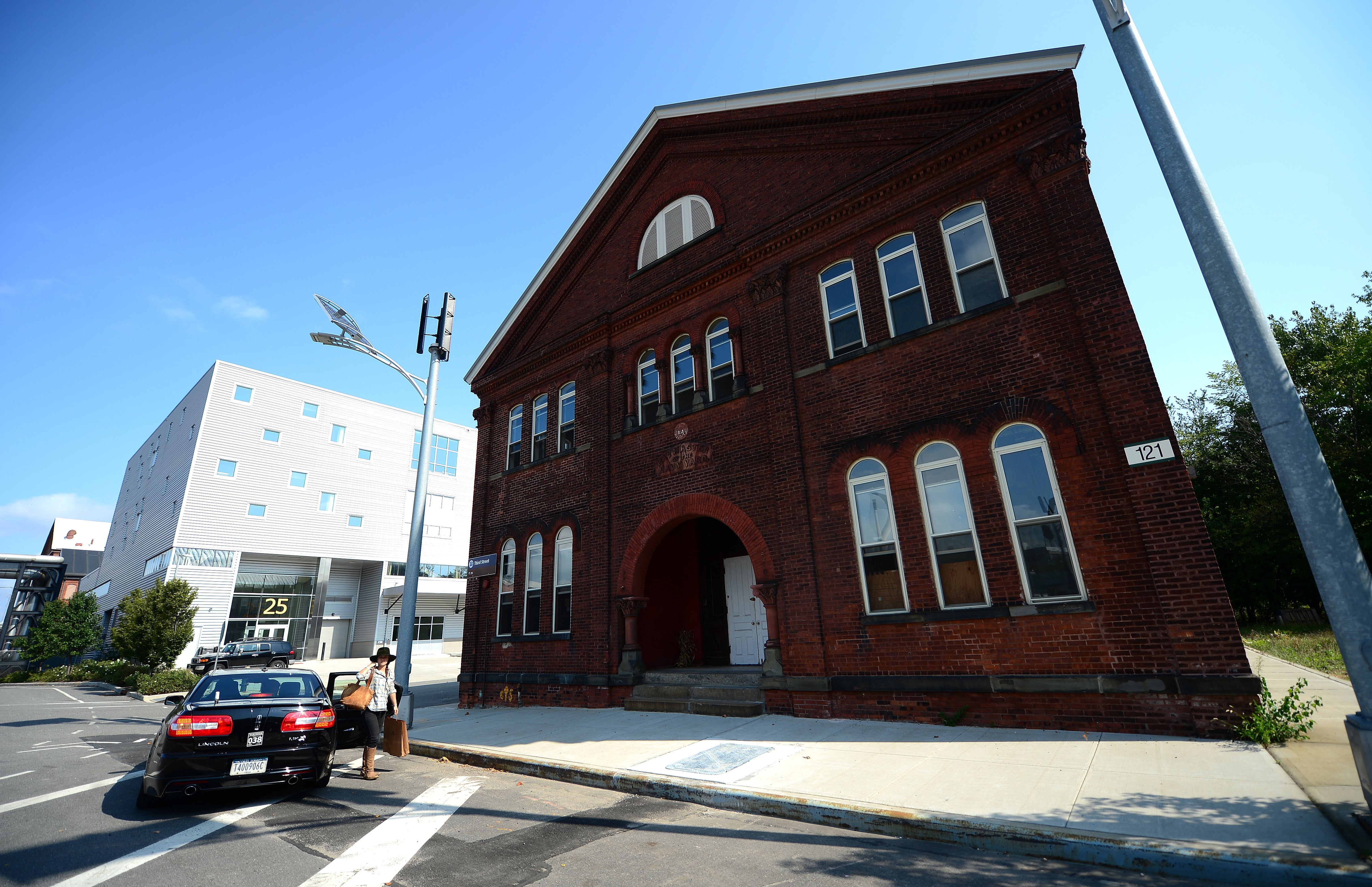 People arrive at the distillery in Brooklyn Navy Yard