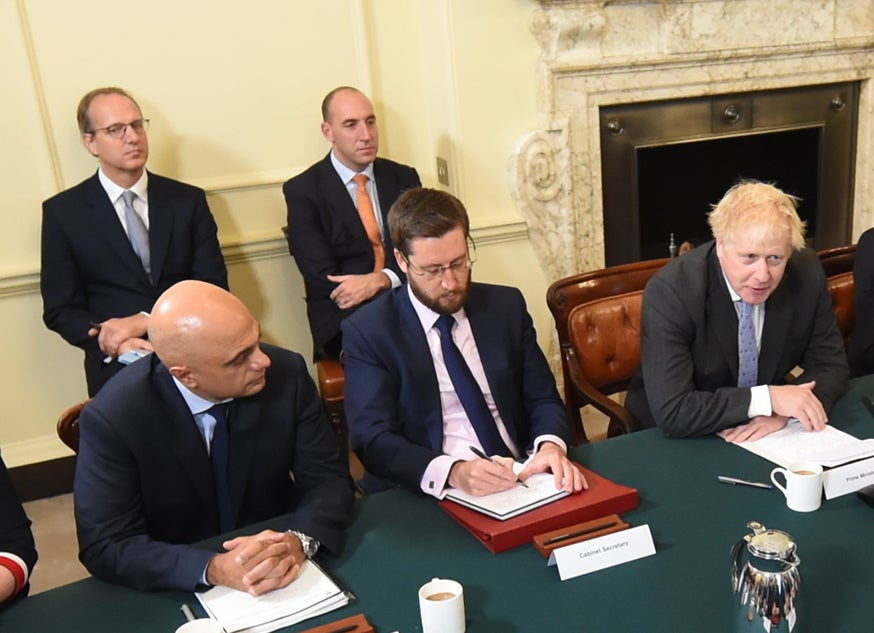 Martin Reynolds (back left), the prime minister’s principal private secretary, attends a Cabinet meeting