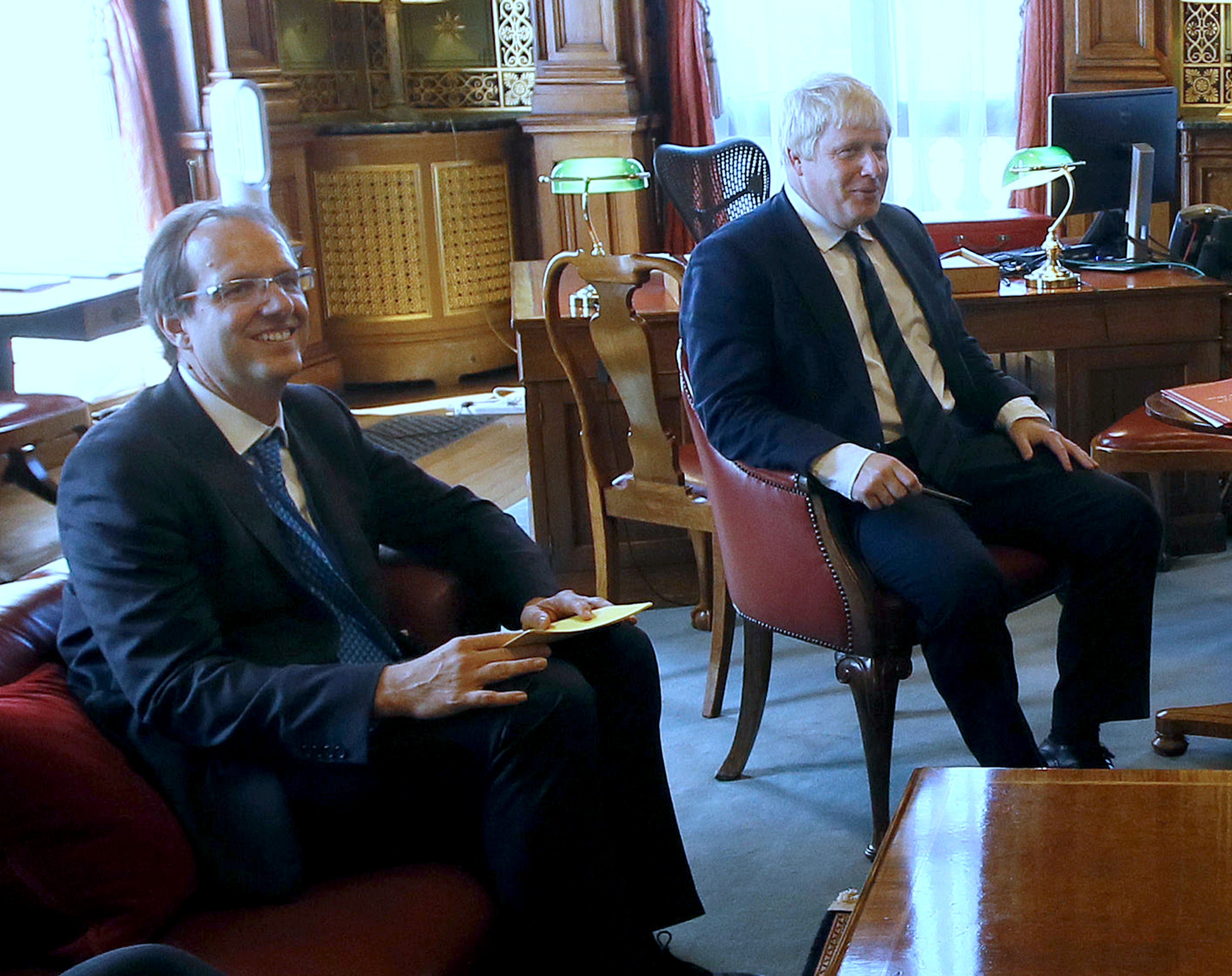 Prime Minister Boris Johnson with his principal private secretary, Martin Reynolds (left) (PA)