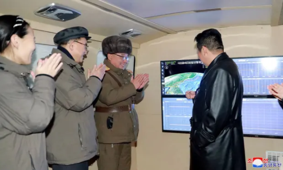 Kim Jong-un watching the launch with top officials