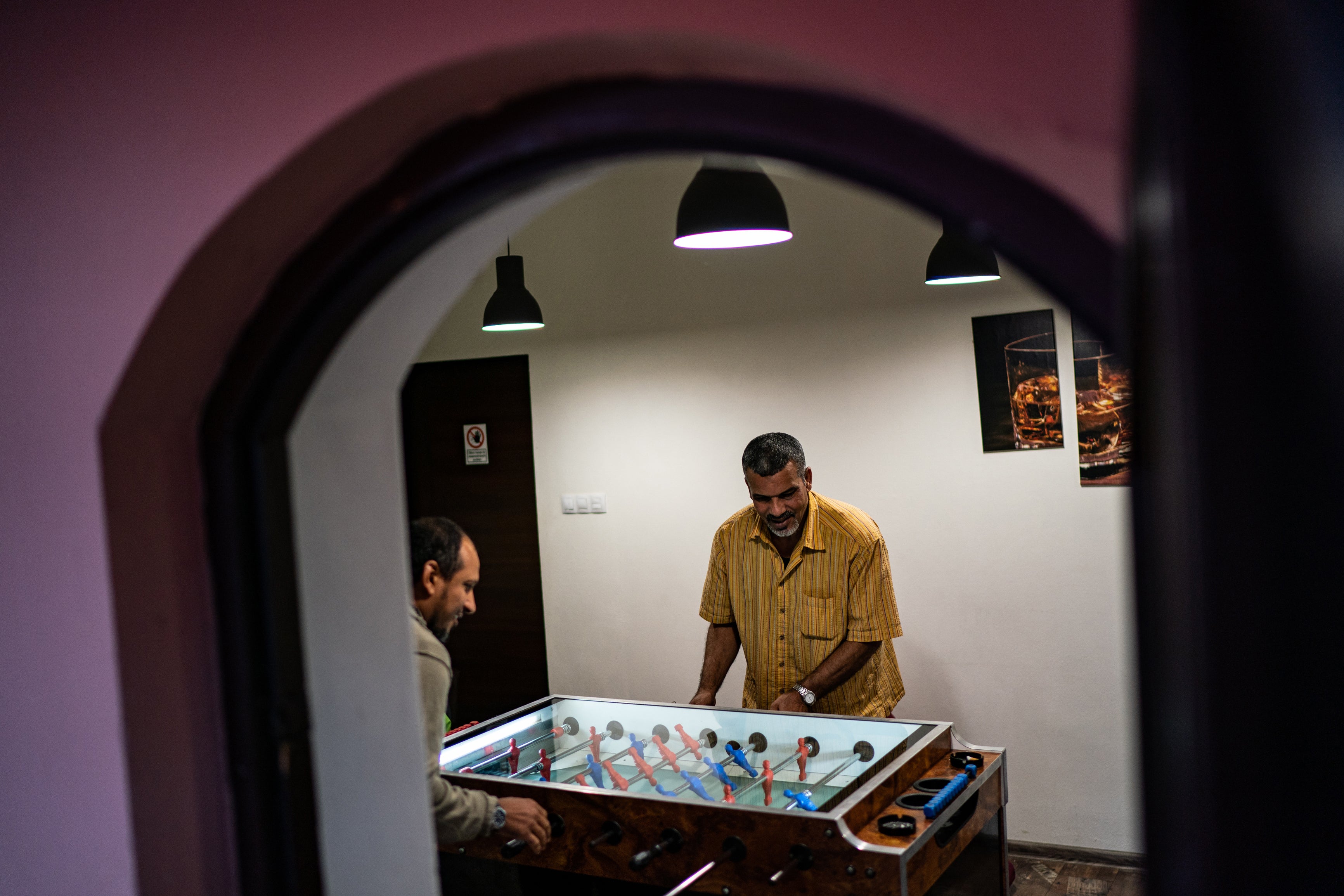 Sliti (right) plays table football with Almerfedi