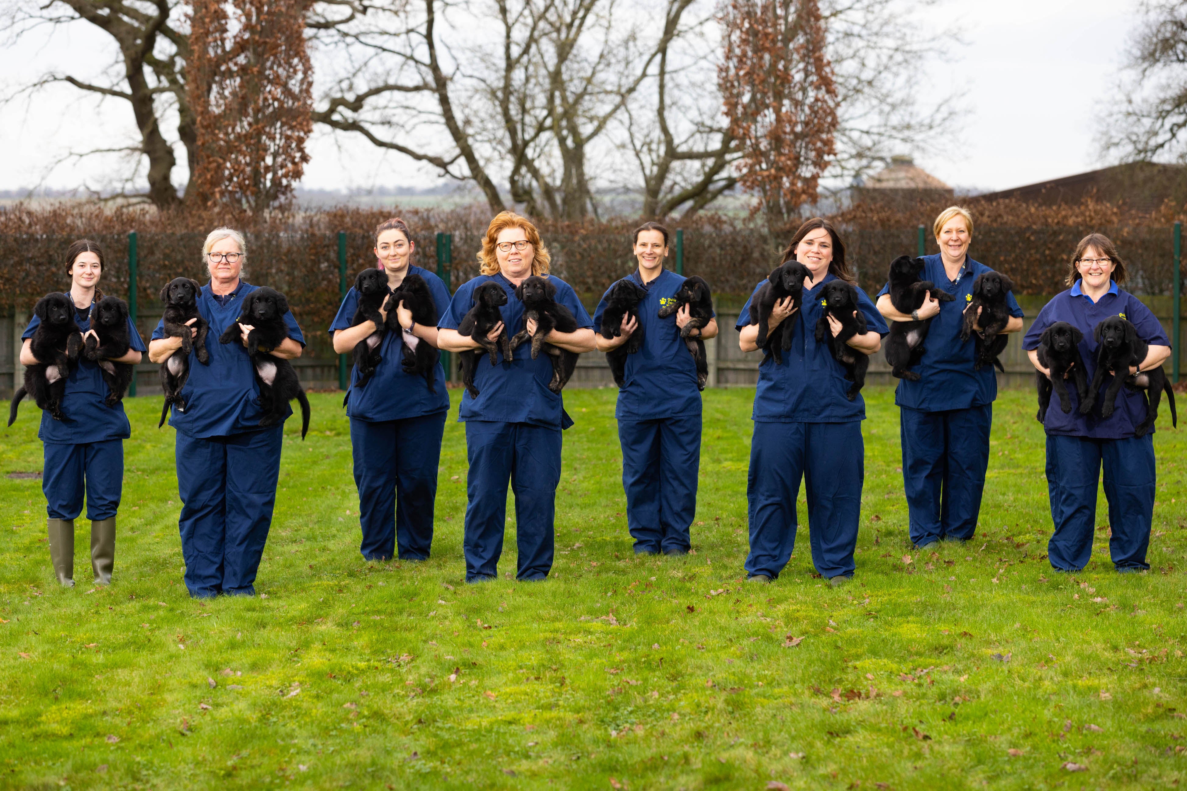 Staff with the puppies at the Guide Dogs National Centre in Leamington Spa (Guide Dogs/PA)