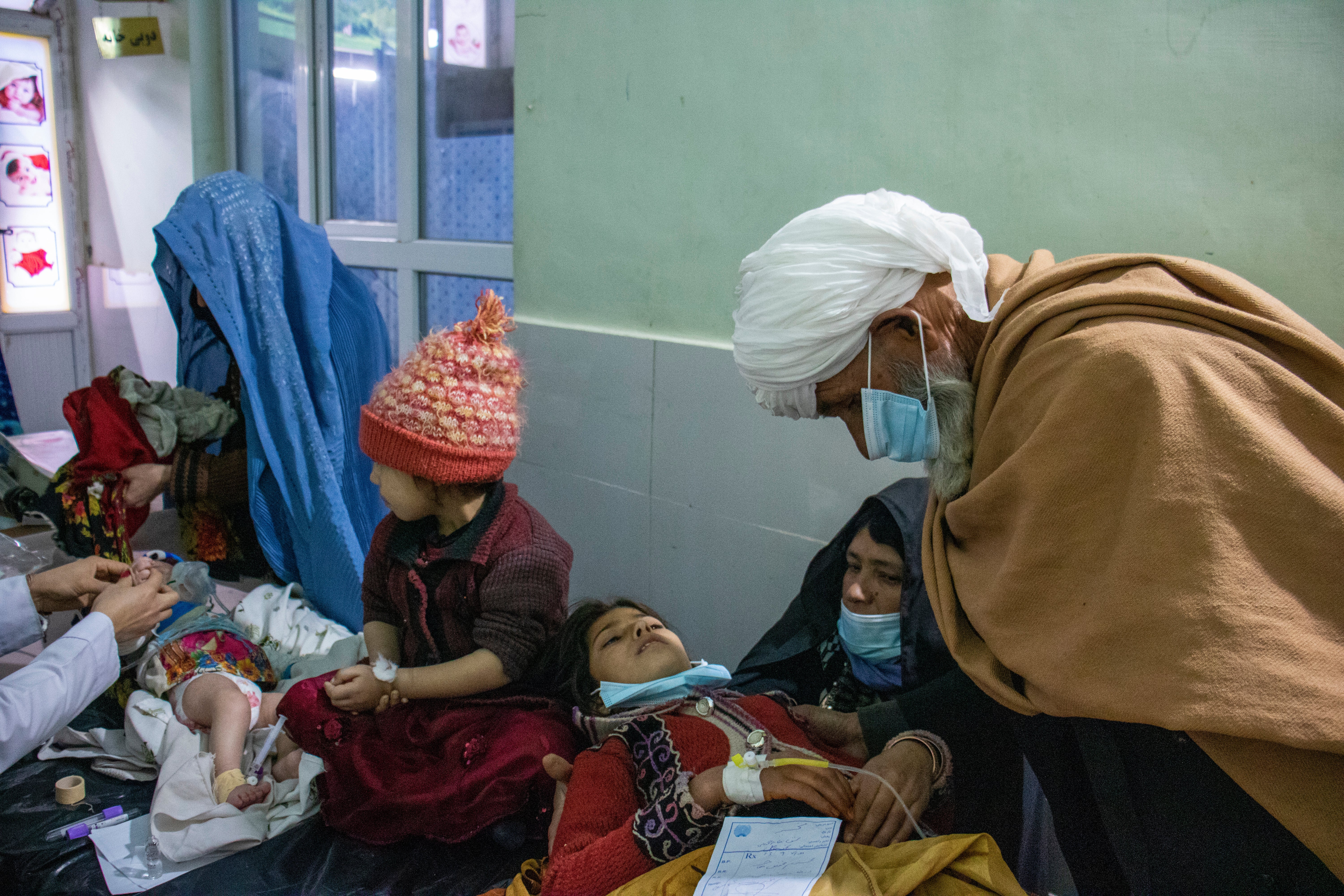 Aid workers are reporting increasing numbers of people travelling for miles from their homes to get treatment at health centres and hospitals. Hadi and his daughters are being seen in a hospital in northwestern Afghanistan