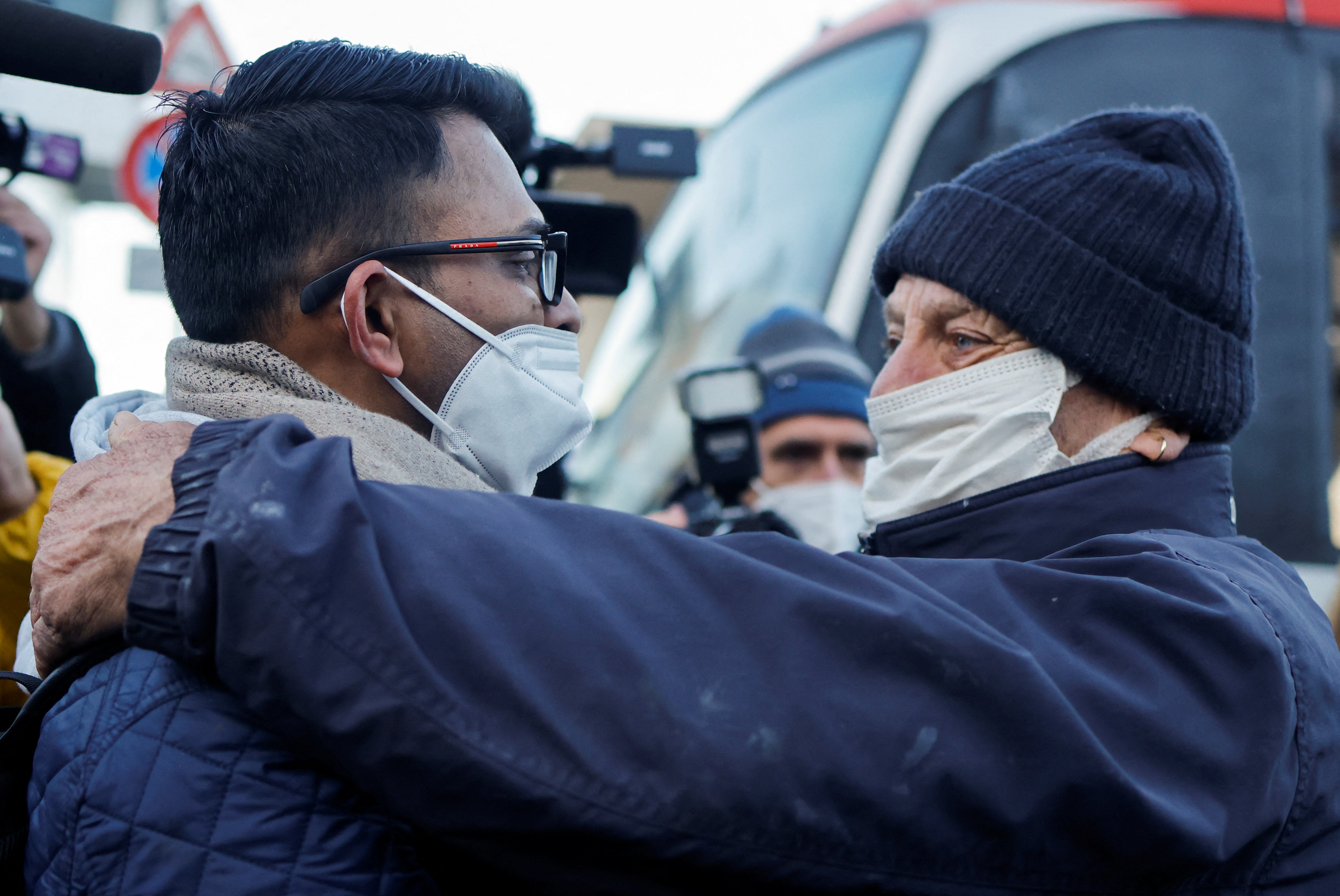 Kevin Rebello, brother of Indian citizen Russel Rebello, who died in the shipwreck, is embraced by one of the habitants of Giglio island, Italy, 12 January 2022