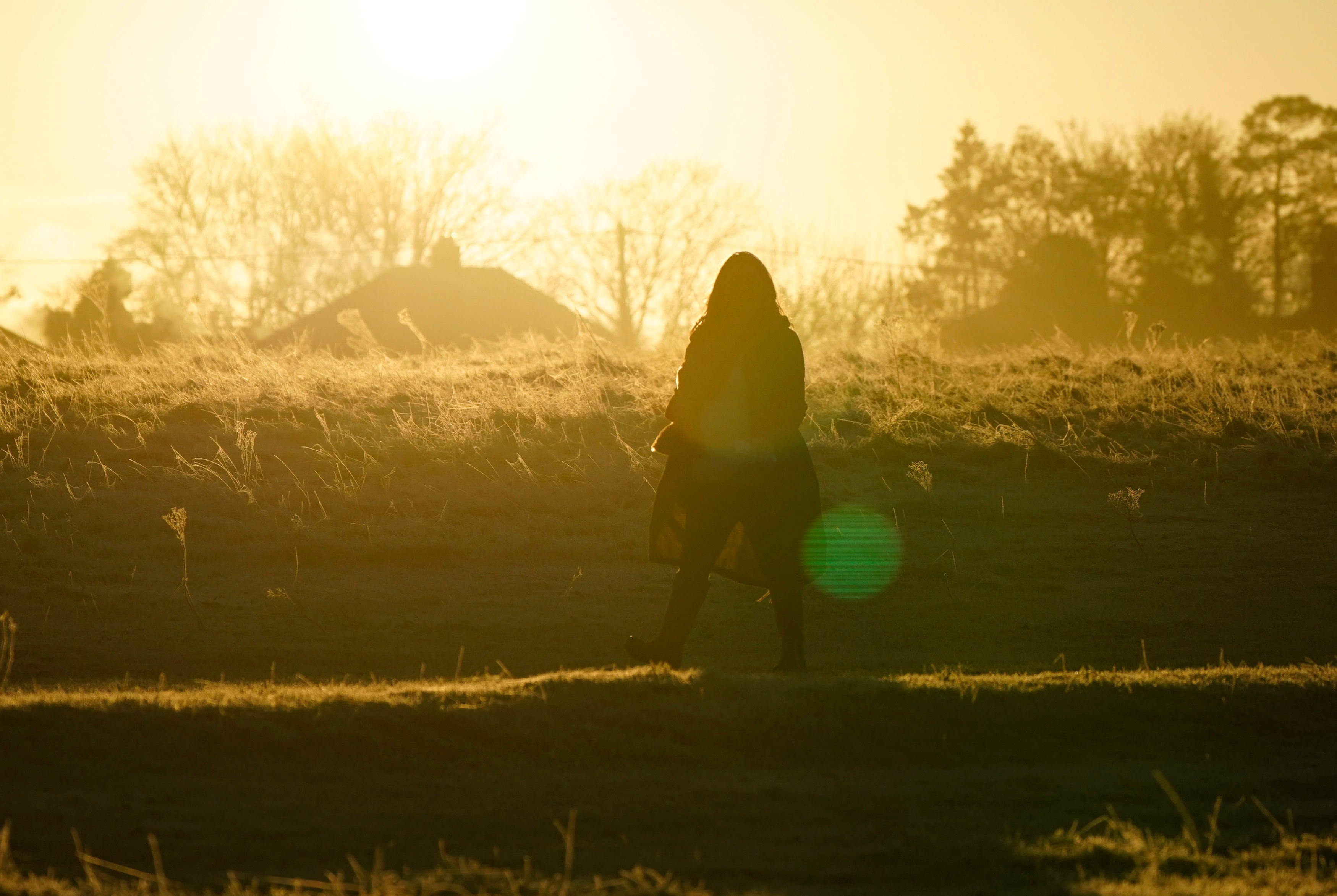 A person walks across Basingstoke Common in Basingstoke, Hampshire. Picture date: Thursday 13 January, 2022.