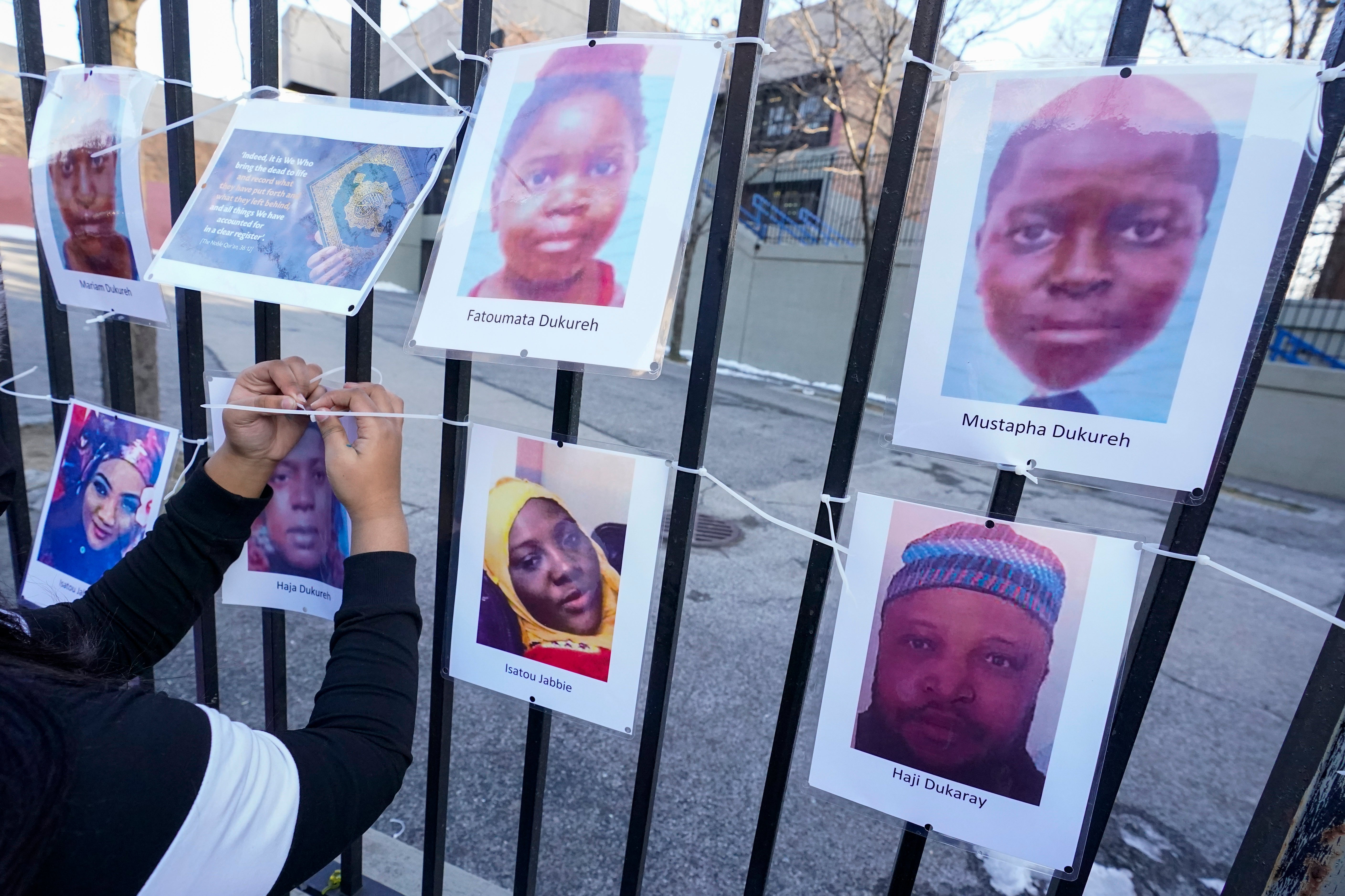 Volunteers with the Wall of Hope Foundation build a memorial wall for the victims of New York City's deadliest fire 30 years