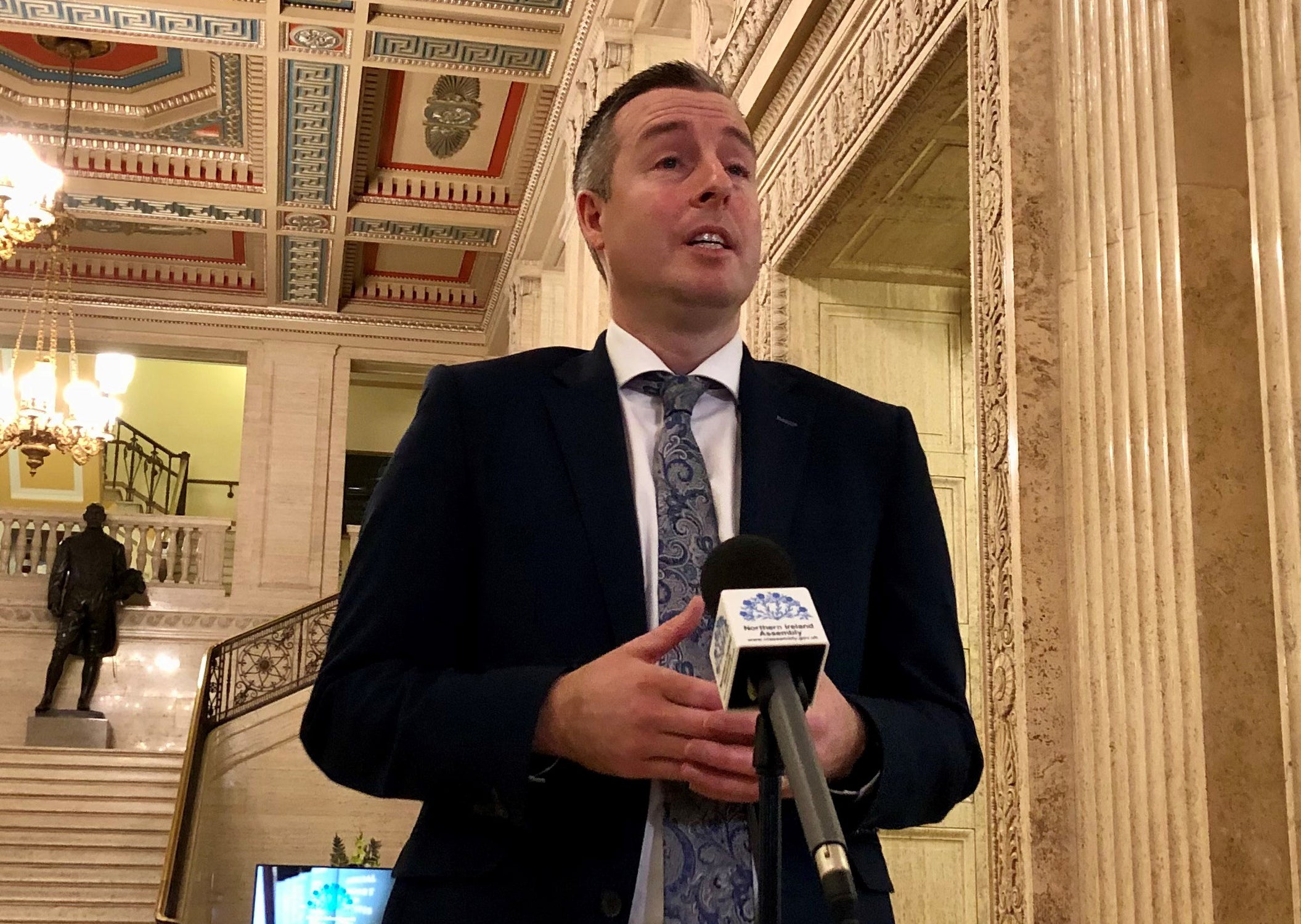 First Minister Paul Givan, speaks to the media in the Great Hall of Parliament Buildings at Stormont (David Young/PA)