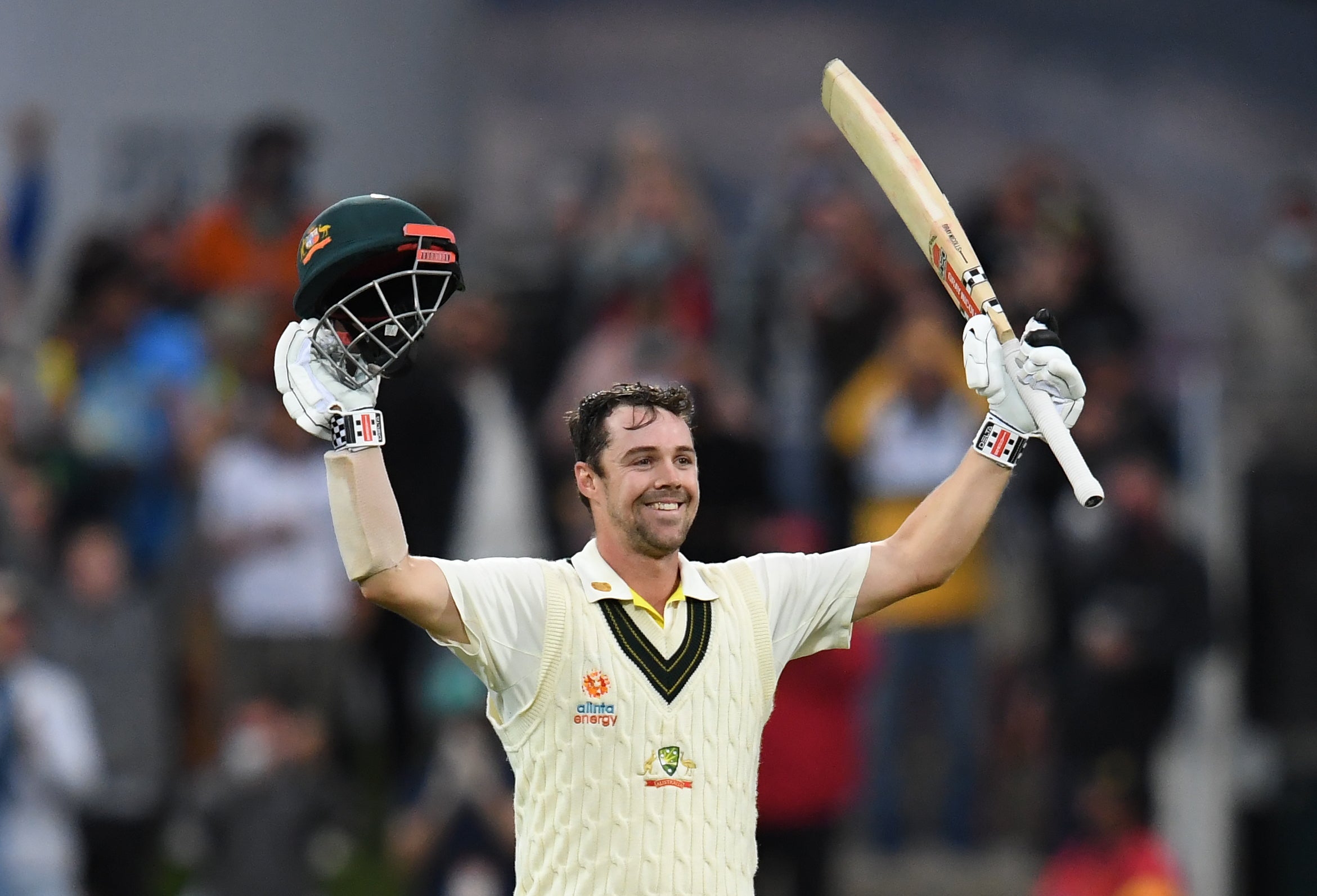 Travis Head celebrates his century (Darren England/AAP/PA)