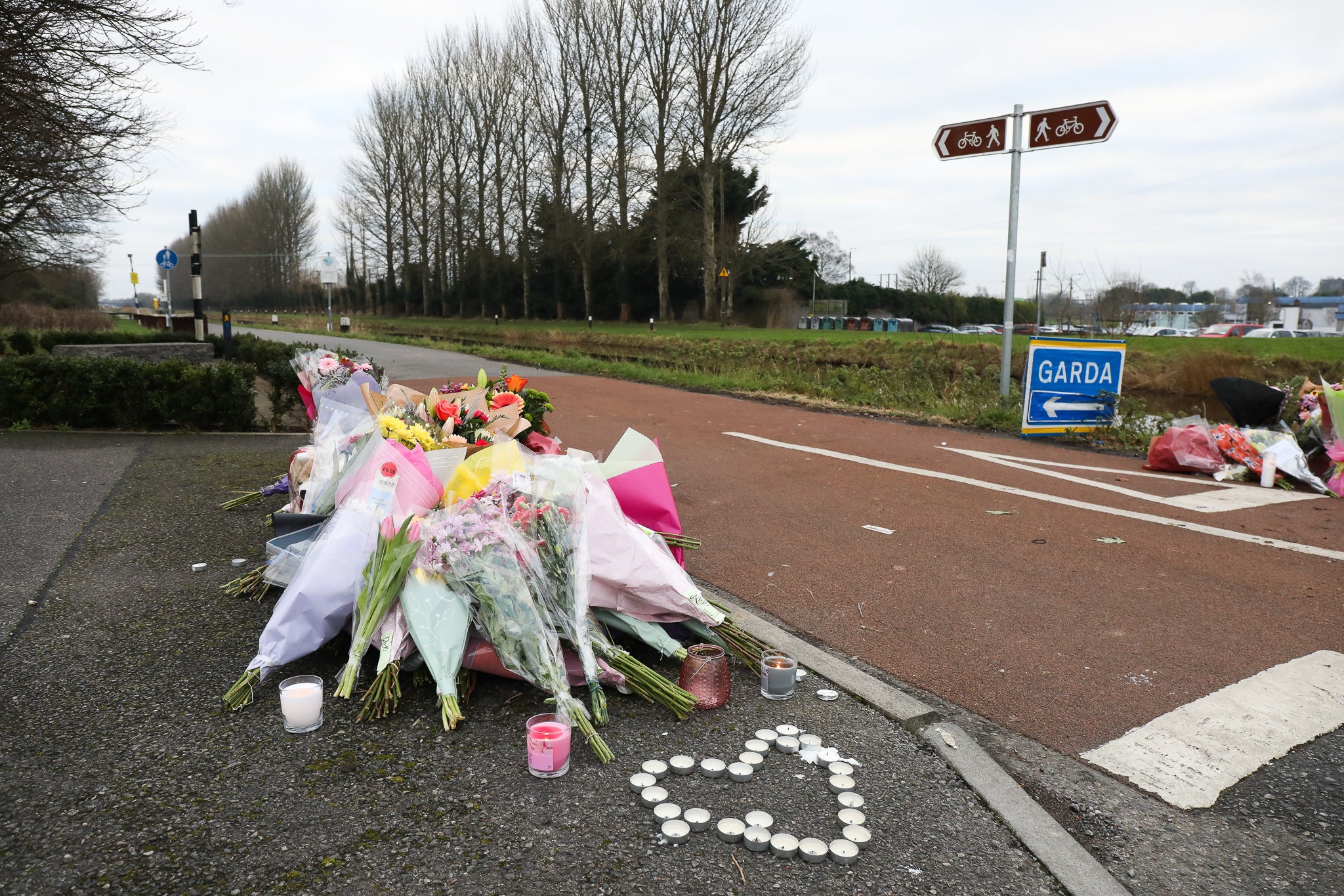 Floral tributes left near to the Grand Canal in Tullamore, County Offaly, where Aisling Murphy was murdered on Wednesday evening (Damien Eagers/PA)