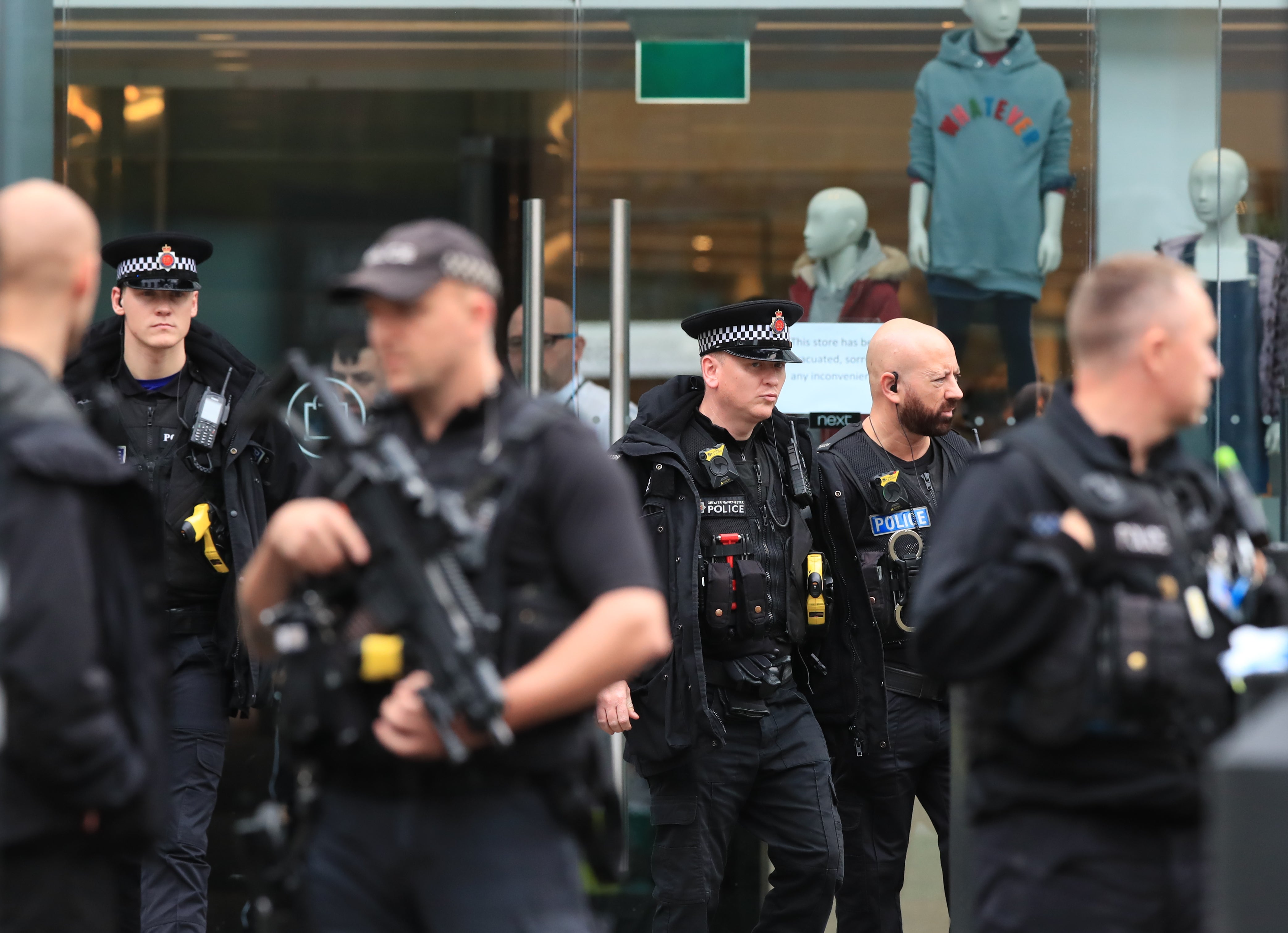 Armed police officers outside the Arndale Centre (Peter Byrne/PA)