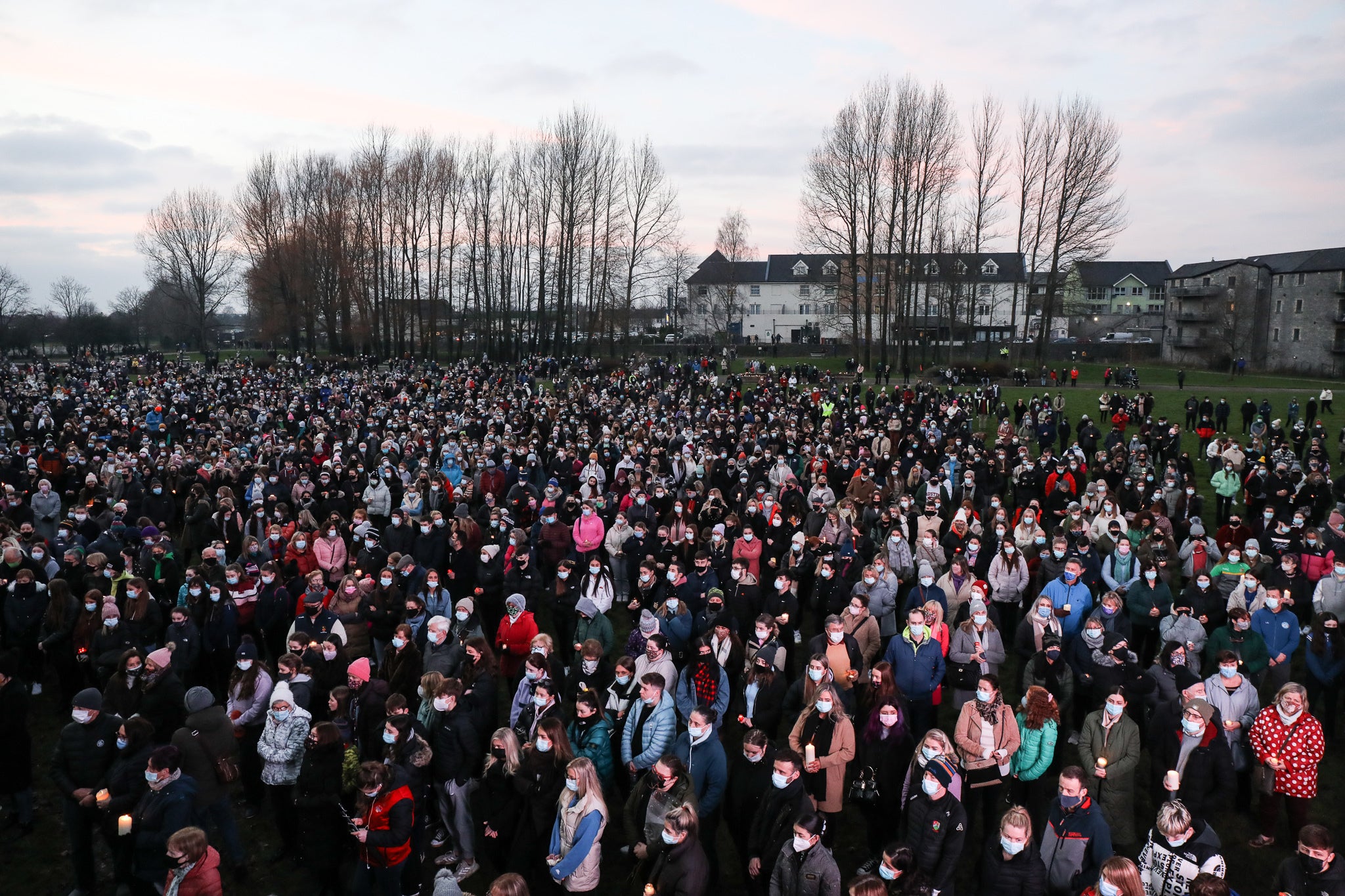 Local people attend a vigil in memory of Aisling Murphy in Tullamore town Park, County Offaly, Aisling Murphy was murdered on Wednesday evening. Ashling died after being attacked while she was jogging along the canal bank at Cappincur, Tullamore, County Offaly at around 4pm on Wednesday. Picture date: Friday January 14, 2022. See PA story IRISH Death. Photo credit should read: Damien Eagers/PA Wire