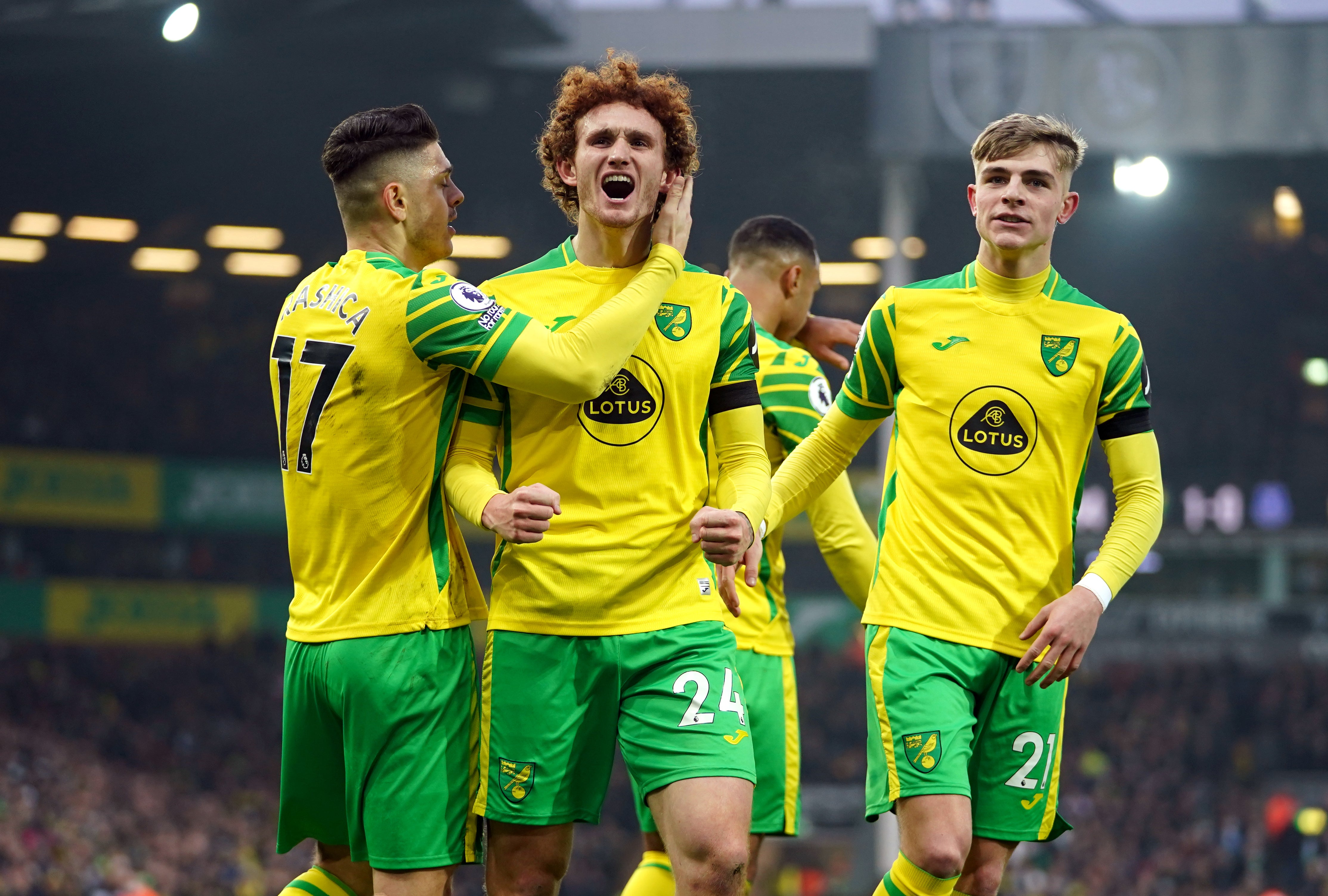 Norwich’s Milot Rashica, Josh Sargent and Brandon Williams celebrate an own goal by Everton’s Michael Keane (Joe Giddens/PA)