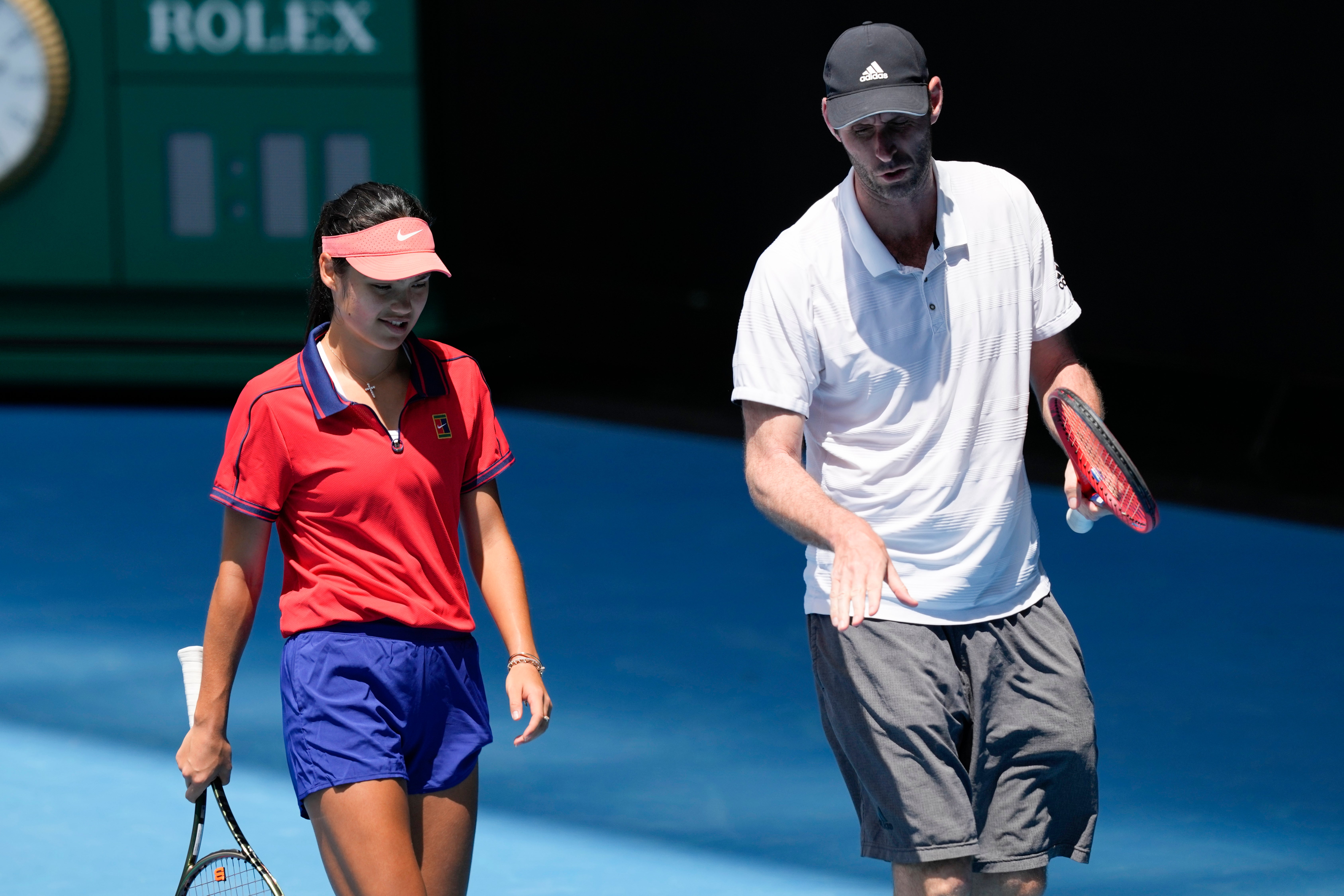 Emma Raducanu talks with Torben Beltz during a practice session on Rod Laver Arena