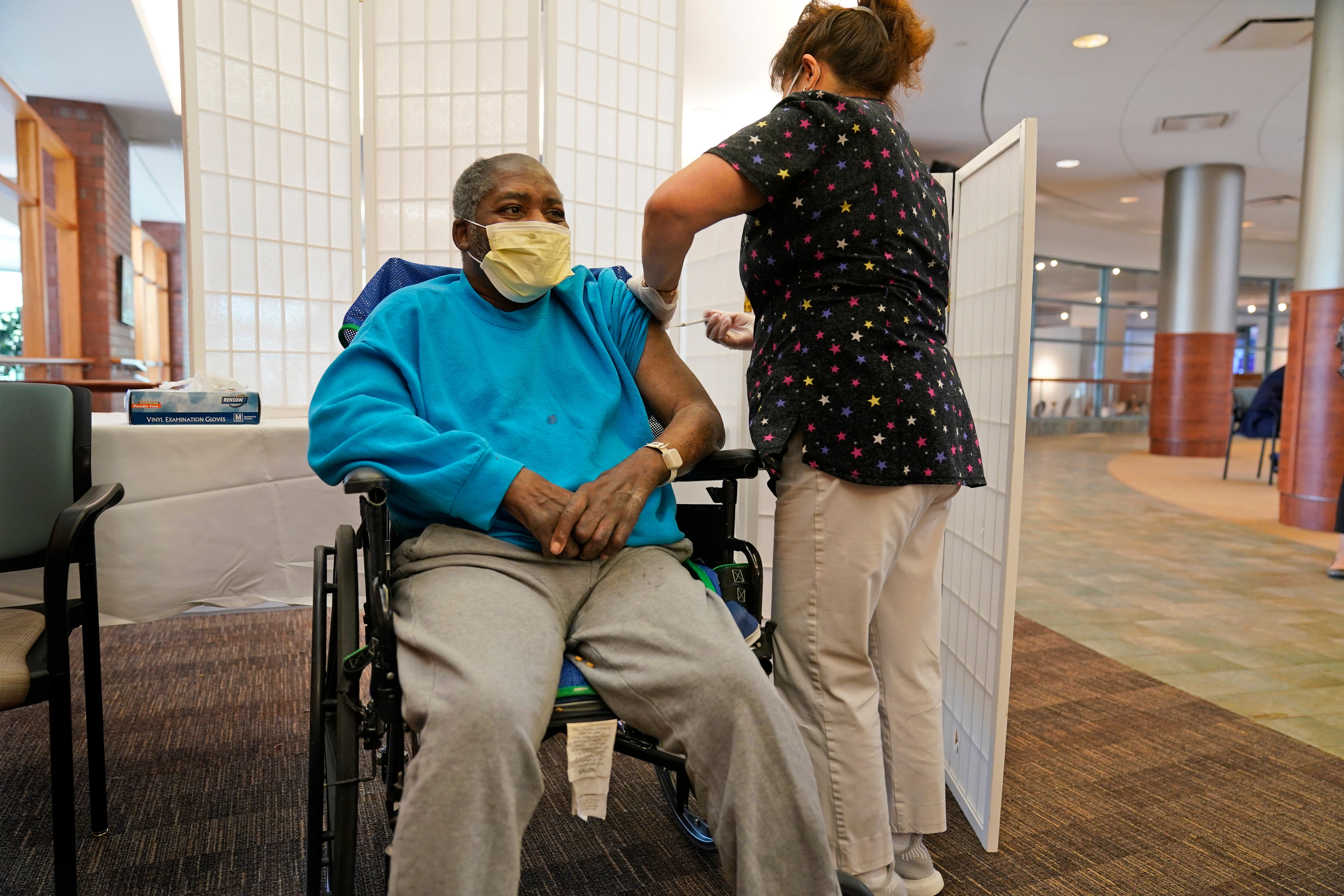 A man receives a booster shoot in Riverdale, New York.