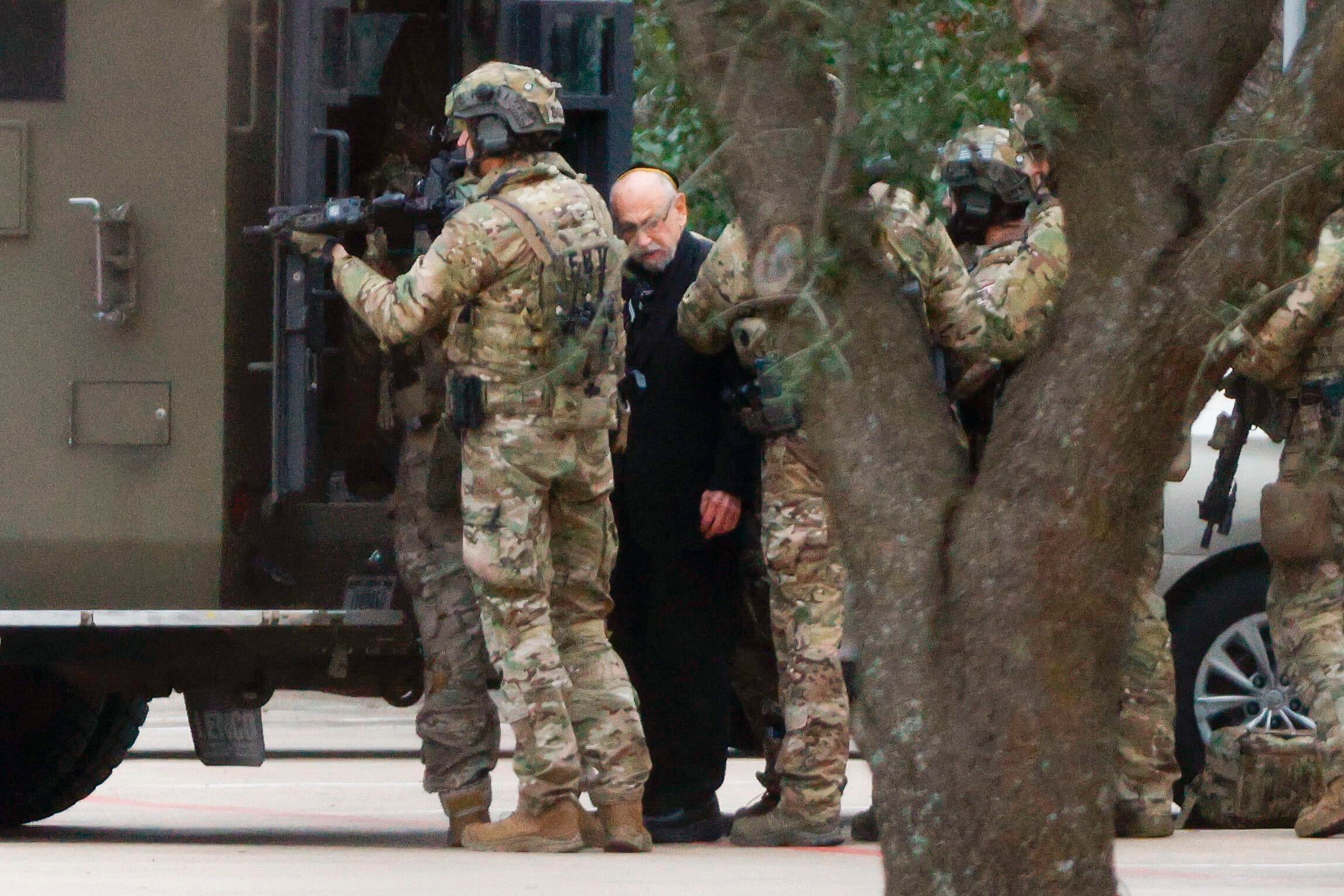 A hostage is released to law enforcement on Saturday afternoon