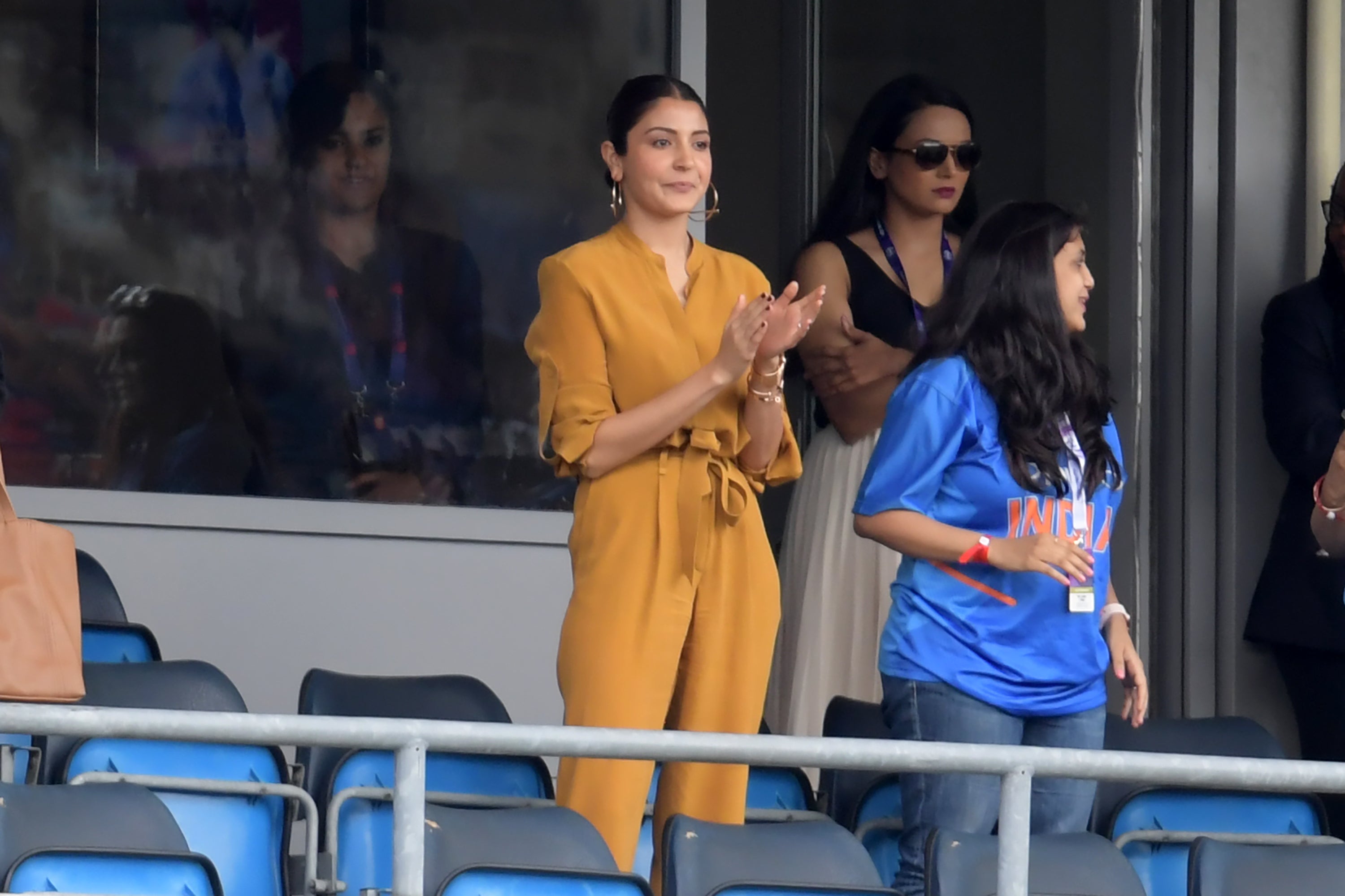 Anushka Sharma (C) applauds India's victory in the 2019 Cricket World Cup group stage match between Sri Lanka and India at Headingley in Leeds, northern England, on 6 July 2019