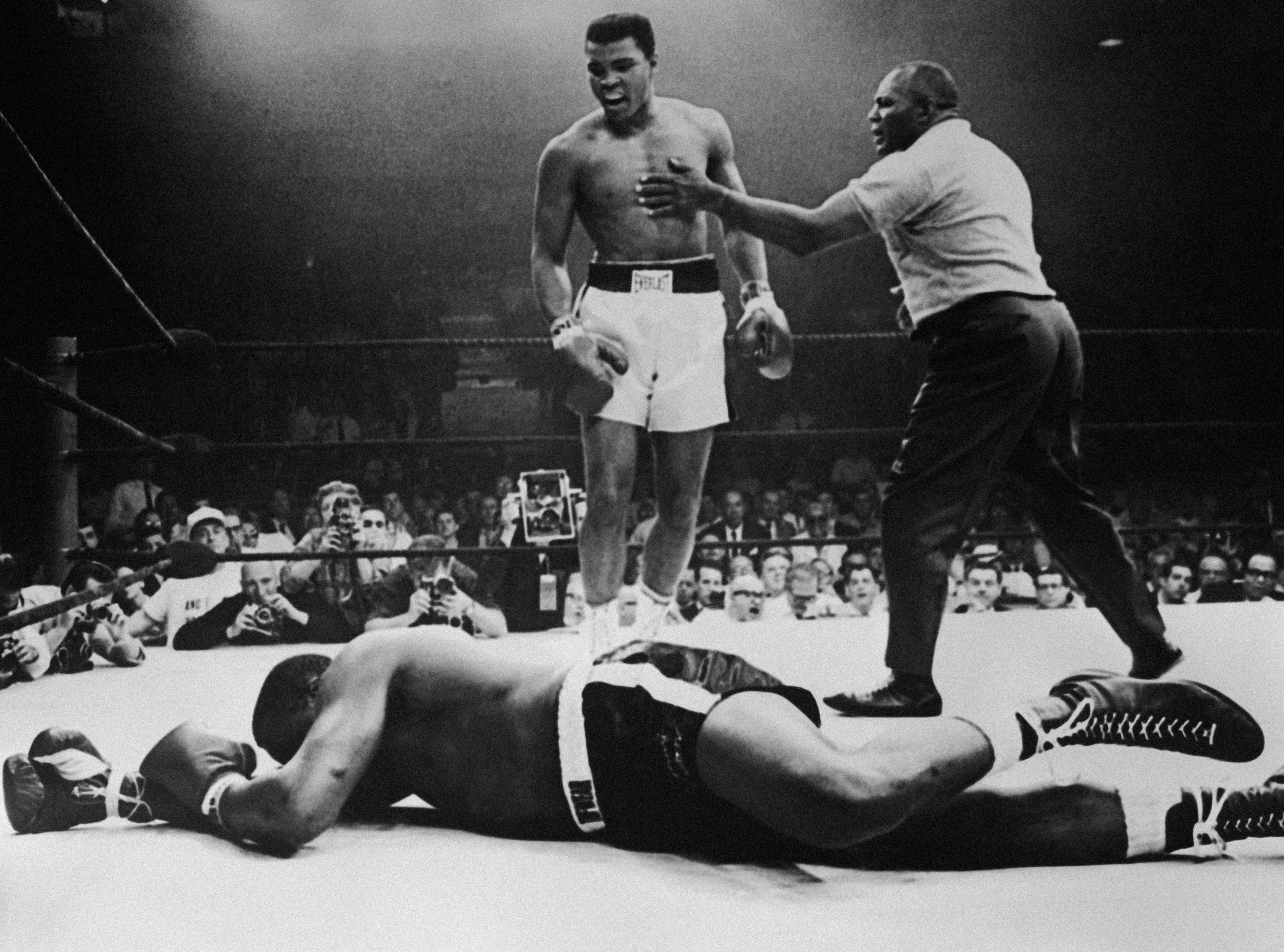 Sonny Liston lies out for the count as Muhammad Ali stands over him in 1965