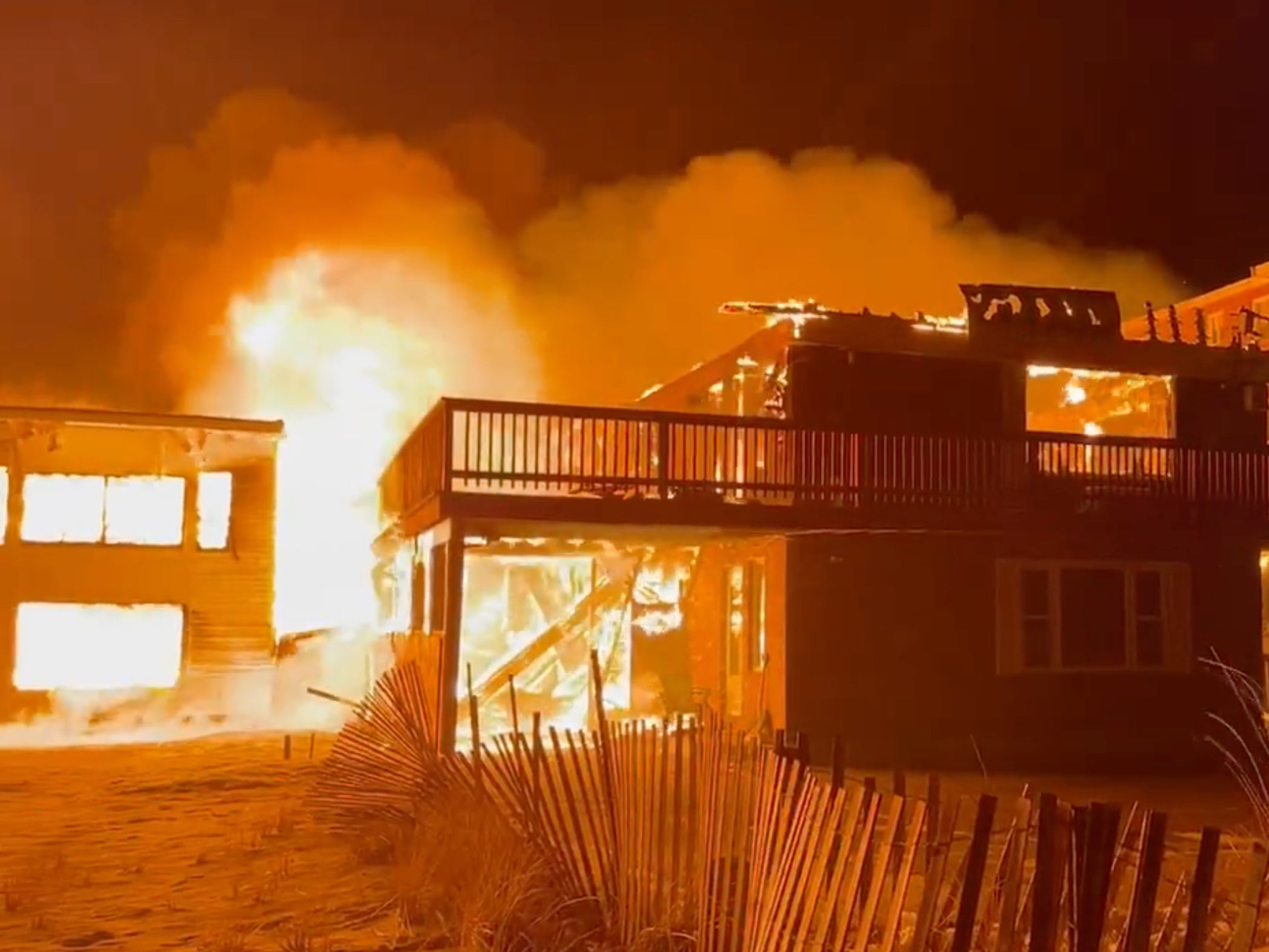 A fire has taken hold of nearby buildings in Salisbury, Massachusetts