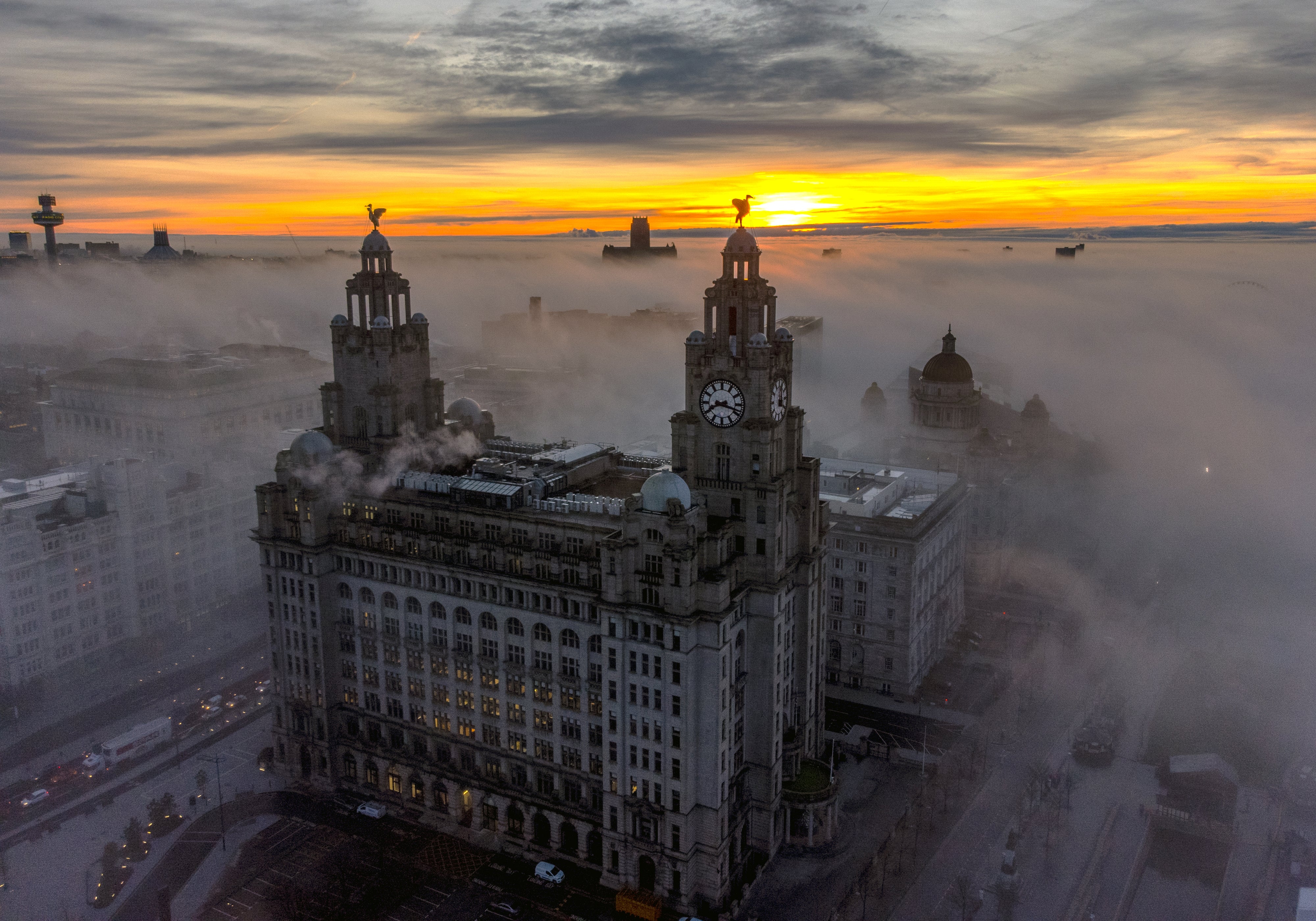 The Royal Liver Building surrounded by early morning fog in Liverpool (Peter Byrne/PA)