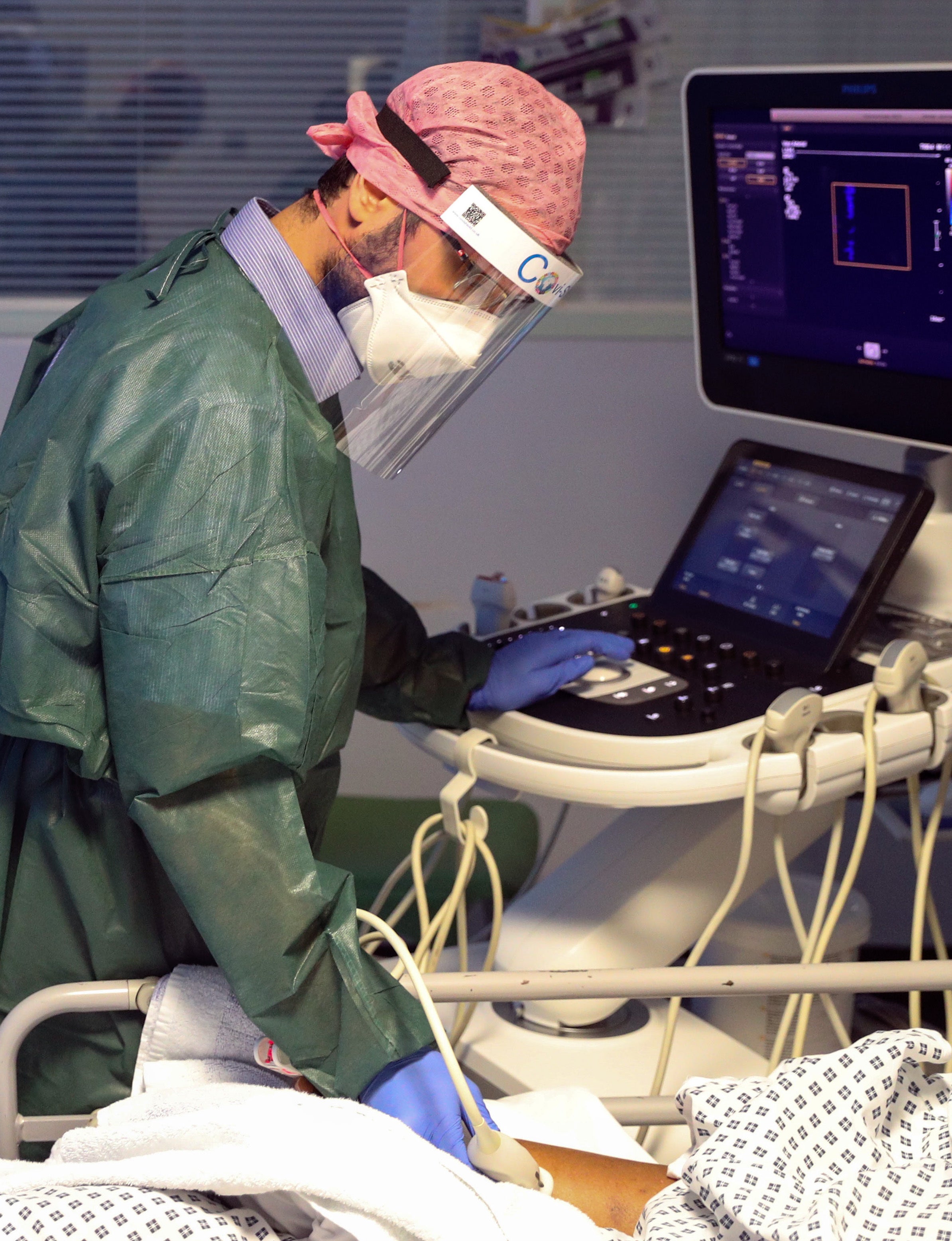 A medic in an intensive care ward treating coronavirus patients (Steve Parsons/PA)