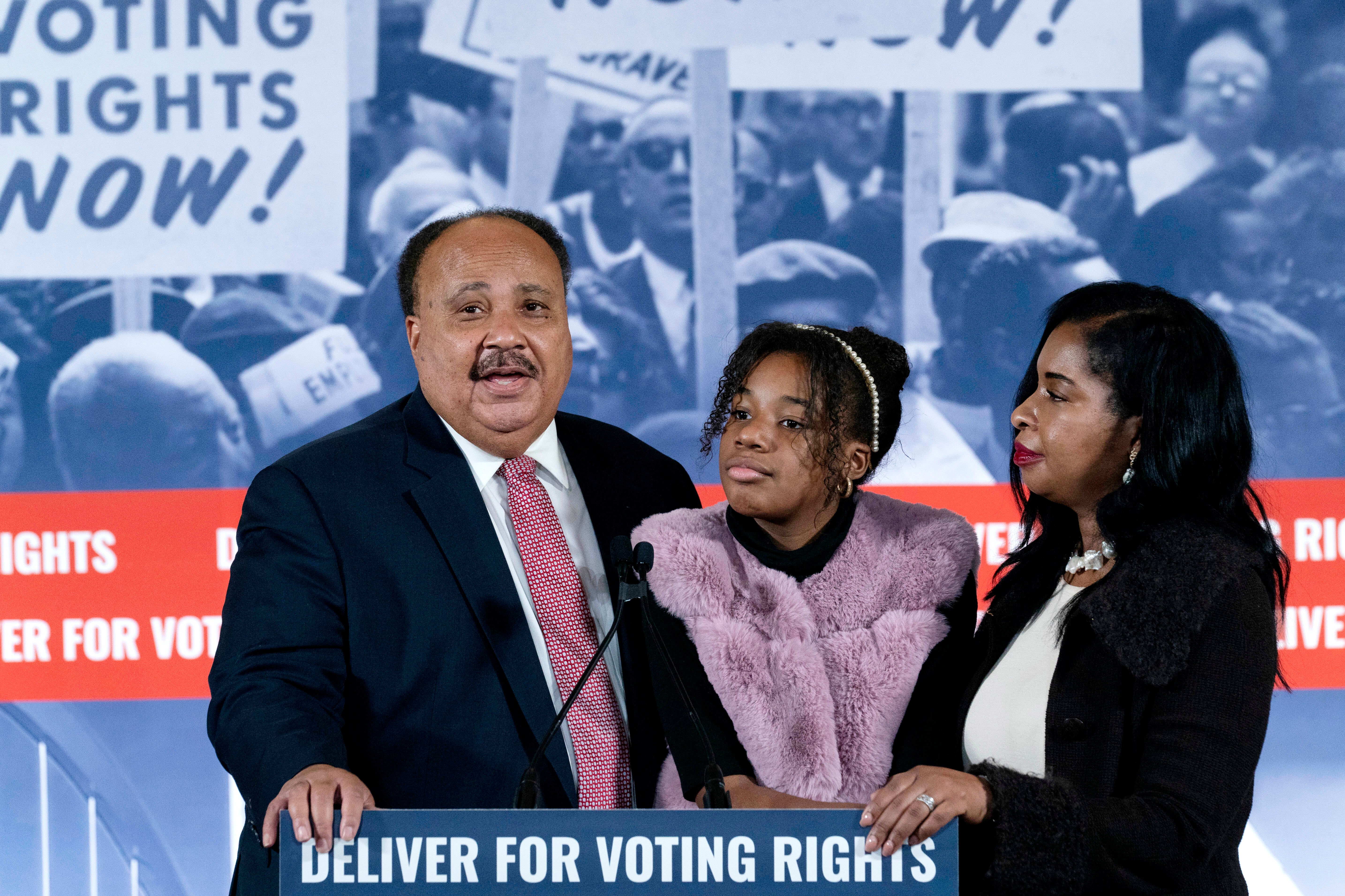 Martin Luther King III, accompanied by his daughter Yolanda Reneee King and his wife Andrea Waters King speaks during a news conference in Washington on Monday