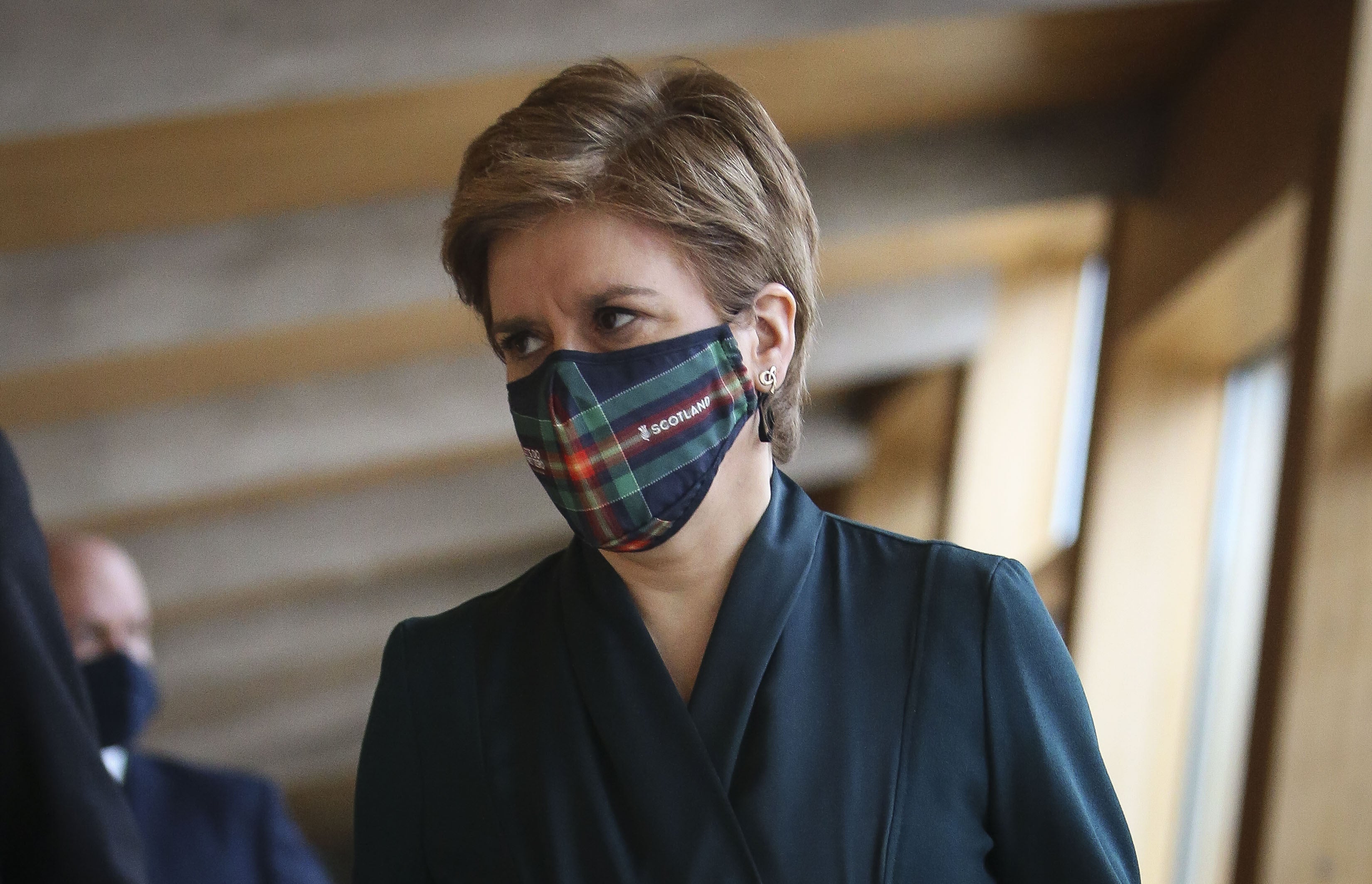 Scotland’s First Minister Nicola Sturgeon, arrives for First Minster’s Questions at the Scottish Parliament in Holyrood, Edinburgh. Picture date: Thursday January 13, 2022.