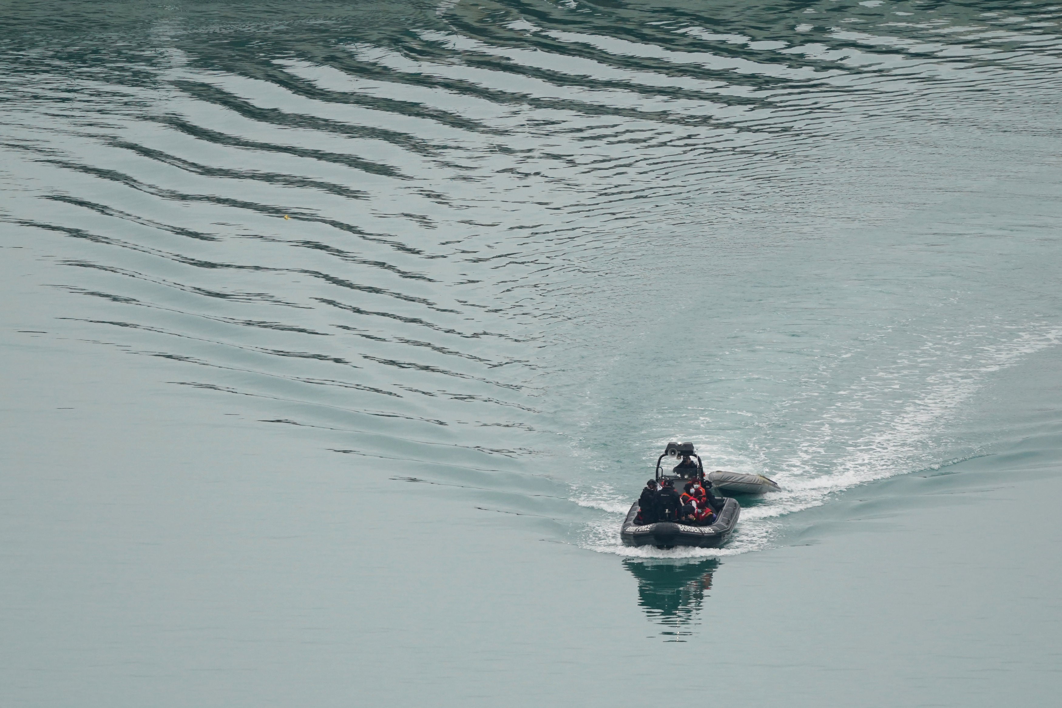 A group of people thought to be migrants being brought in to Dover, Kent