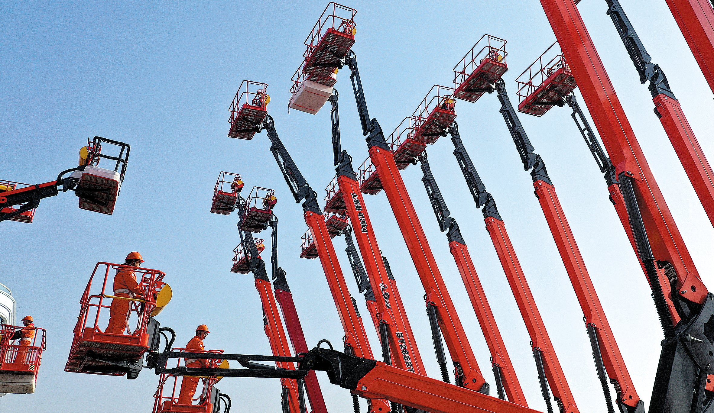 Workers at the production line of a machinery manufacturing company in Huzhou, Zhejiang province