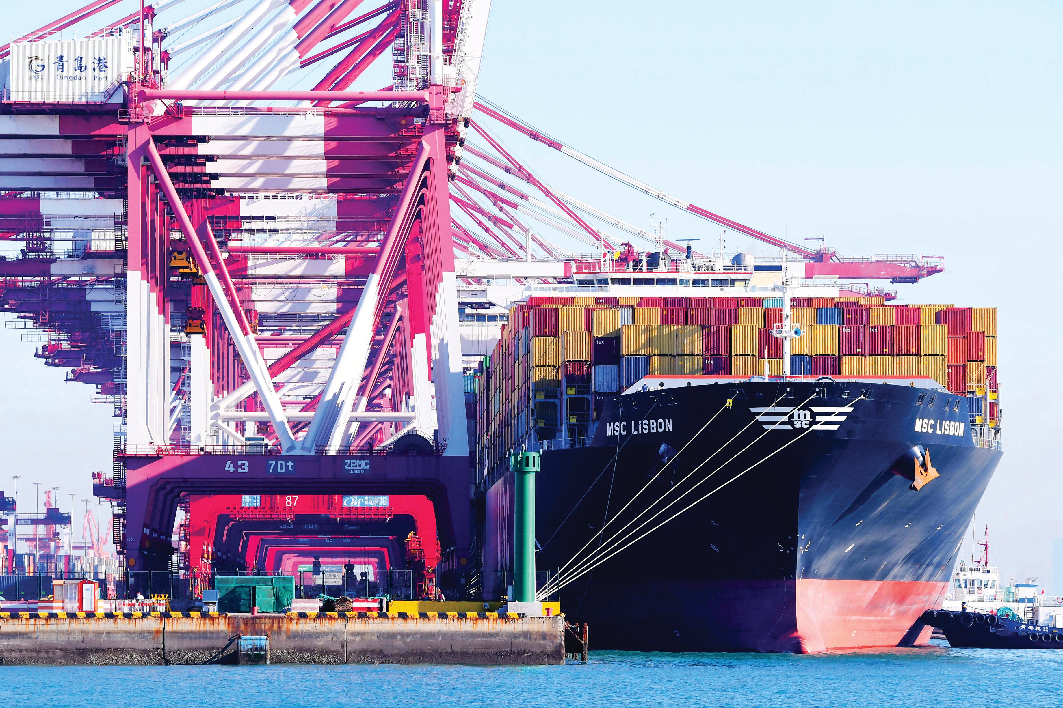 Cargo is unloaded at Qingdao Port, Shandong province.