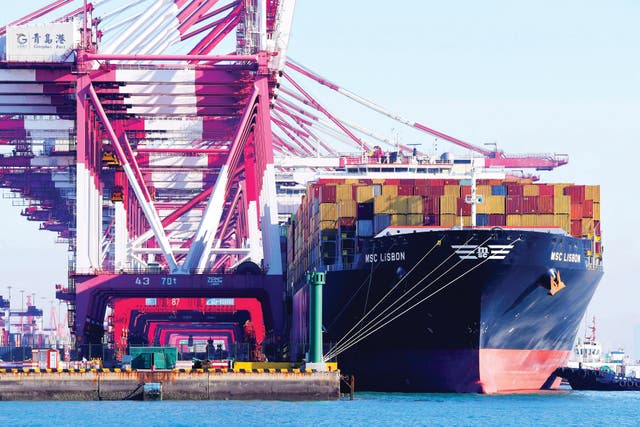 <p>Cargo is unloaded at Qingdao Port, Shandong province.</p>