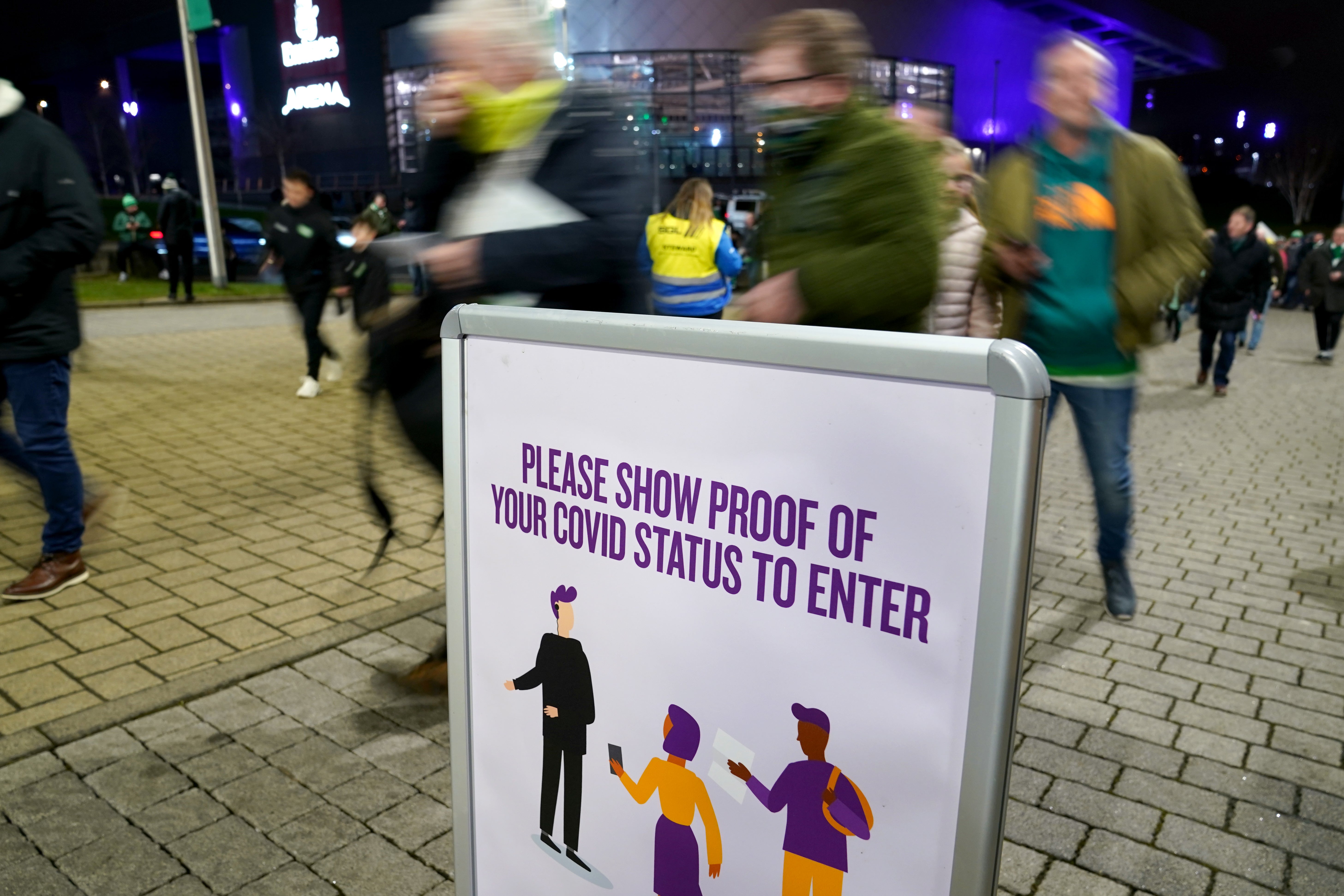 Celtic fans show Covid passes upon entry before the Premiership match at Celtic Park, Glasgow (Andrew Milligan/PA)