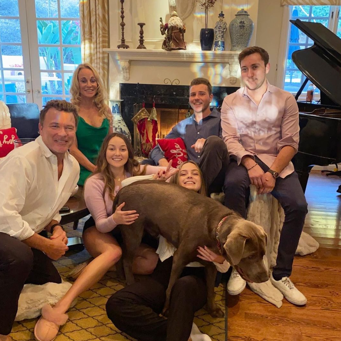 Brianna Kupfer, sitting behind the family dog, with her parents and brothers Brandon and Tucker and her sister Mikaela