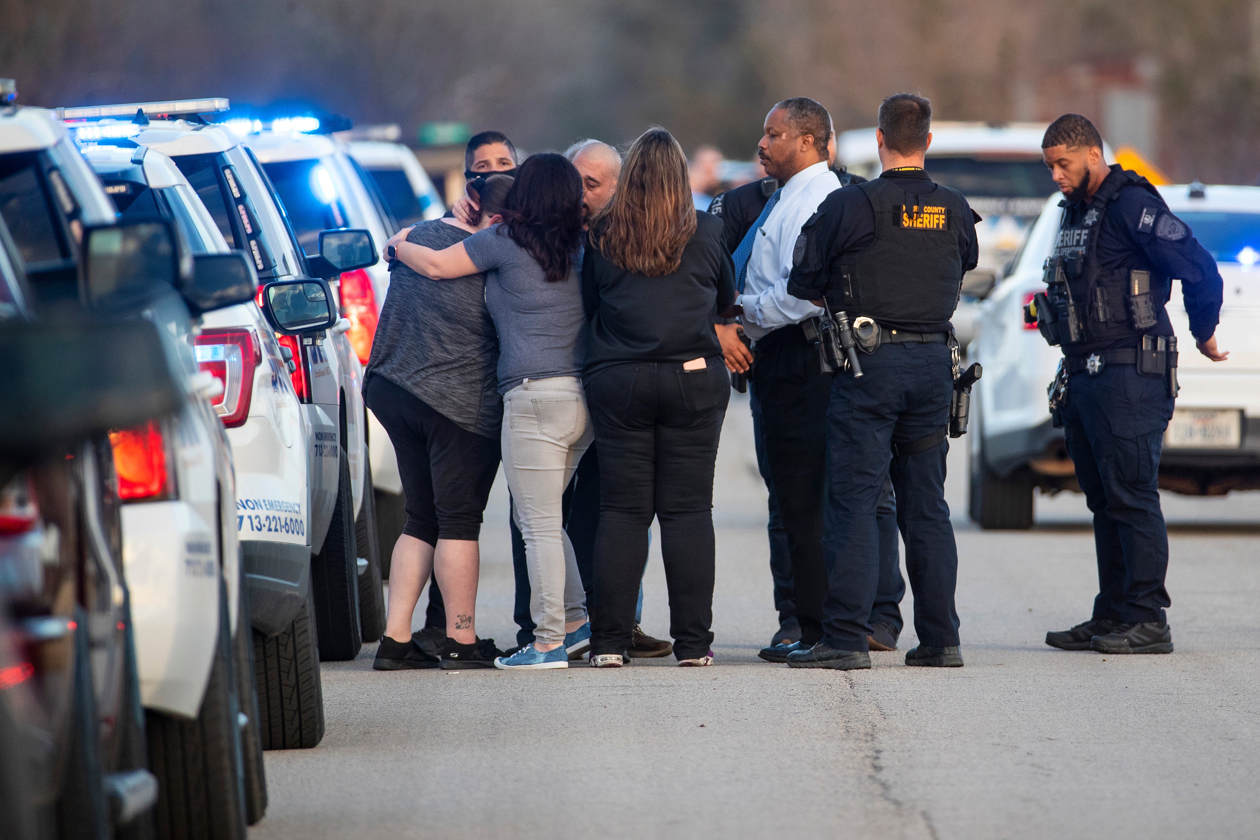 Emotional family members on the scene after the discovery of the three bodies