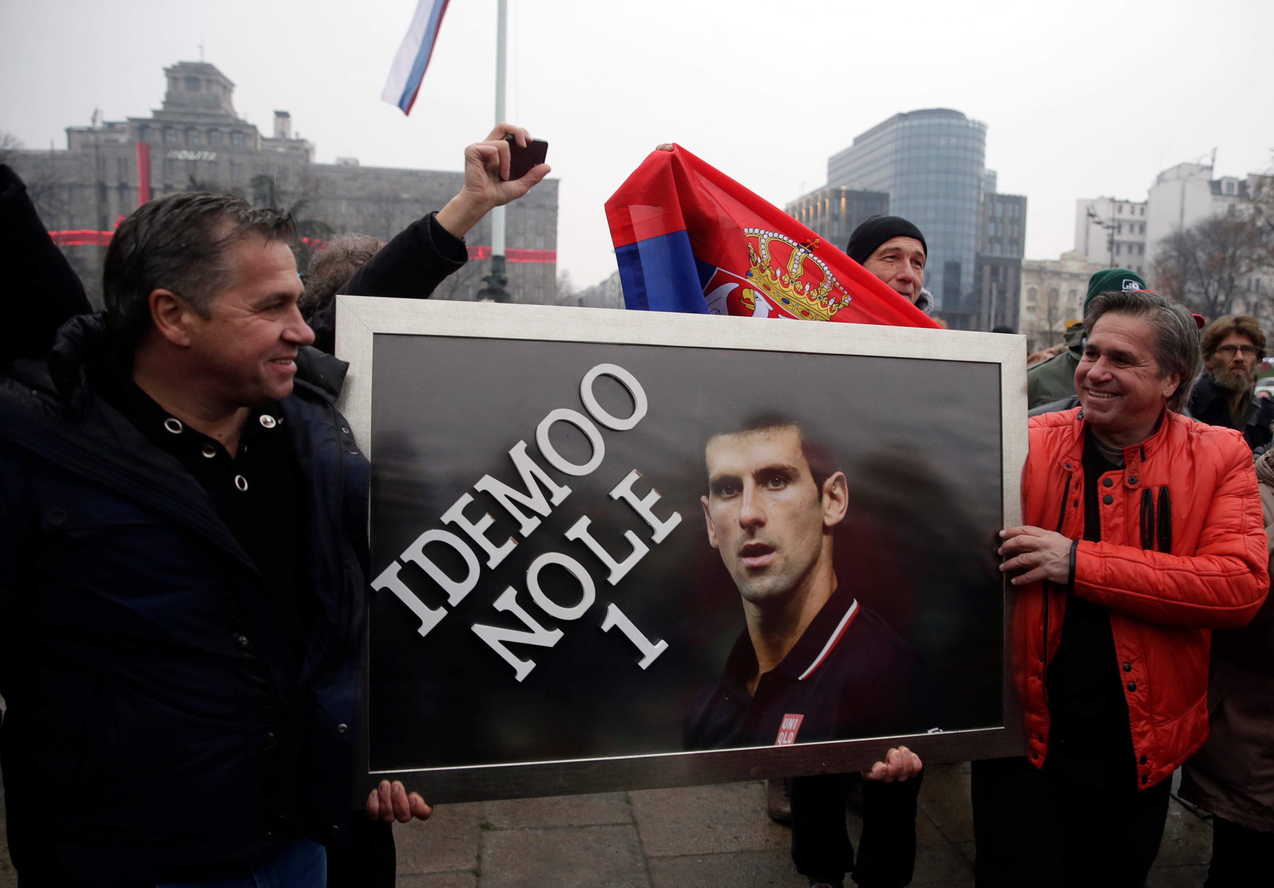 File photo: Serbian supporters of Djokovic hold a banner during a protest of support in Belgrade, Serbia, 8 January 2022